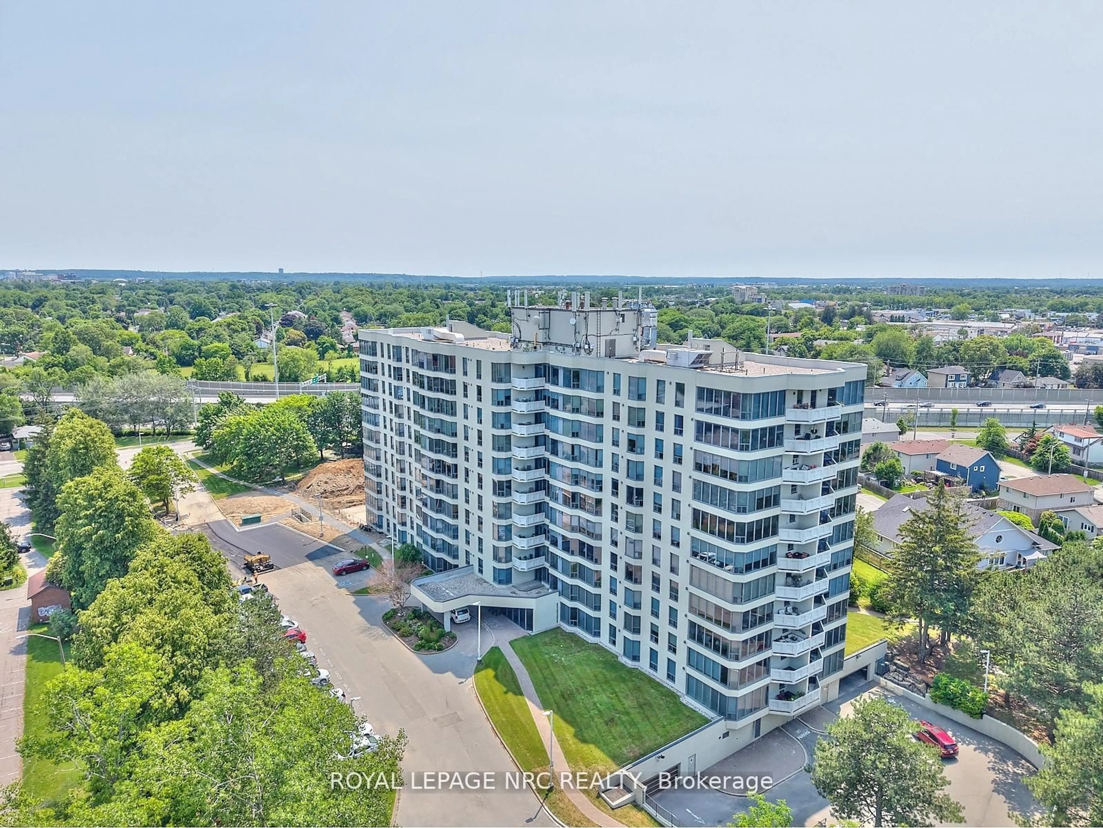 A pic from outside/outdoor area/front of a property/back of a property/a pic from drone, city buildings view from balcony for 81 Scott Dr #201, St. Catharines Ontario L2N 7L5