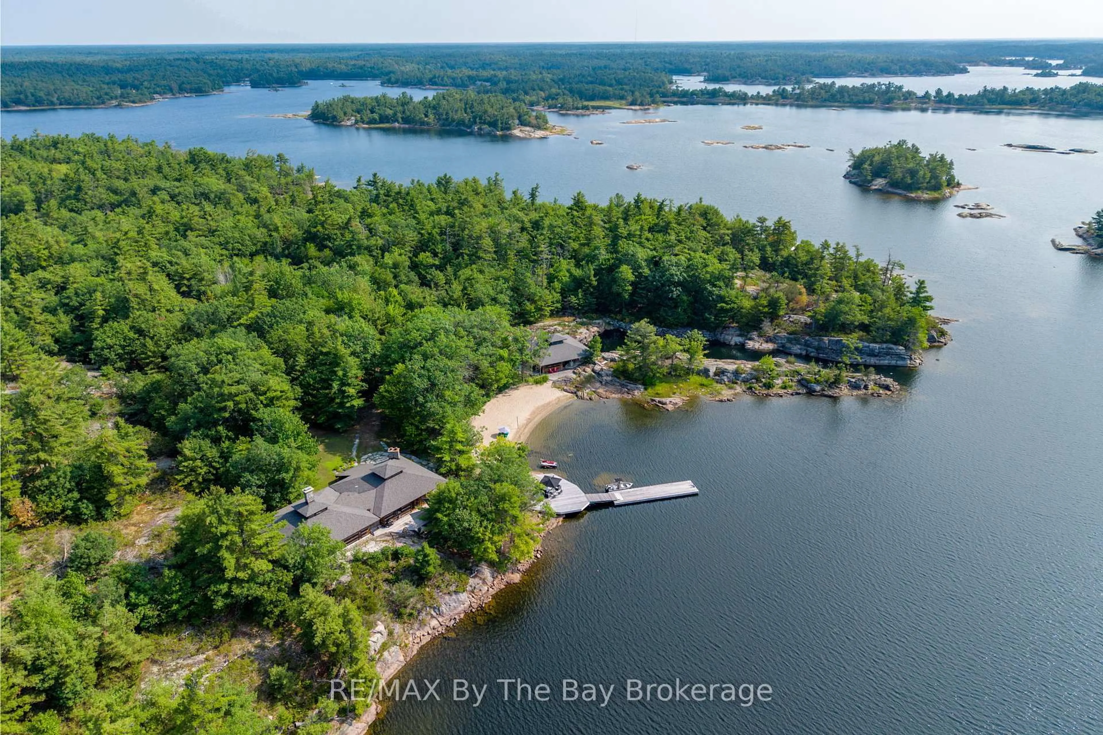 A pic from outside/outdoor area/front of a property/back of a property/a pic from drone, water/lake/river/ocean view for 1216 Island 2060/Big Ship Island, Georgian Bay Ontario P0E 1E0