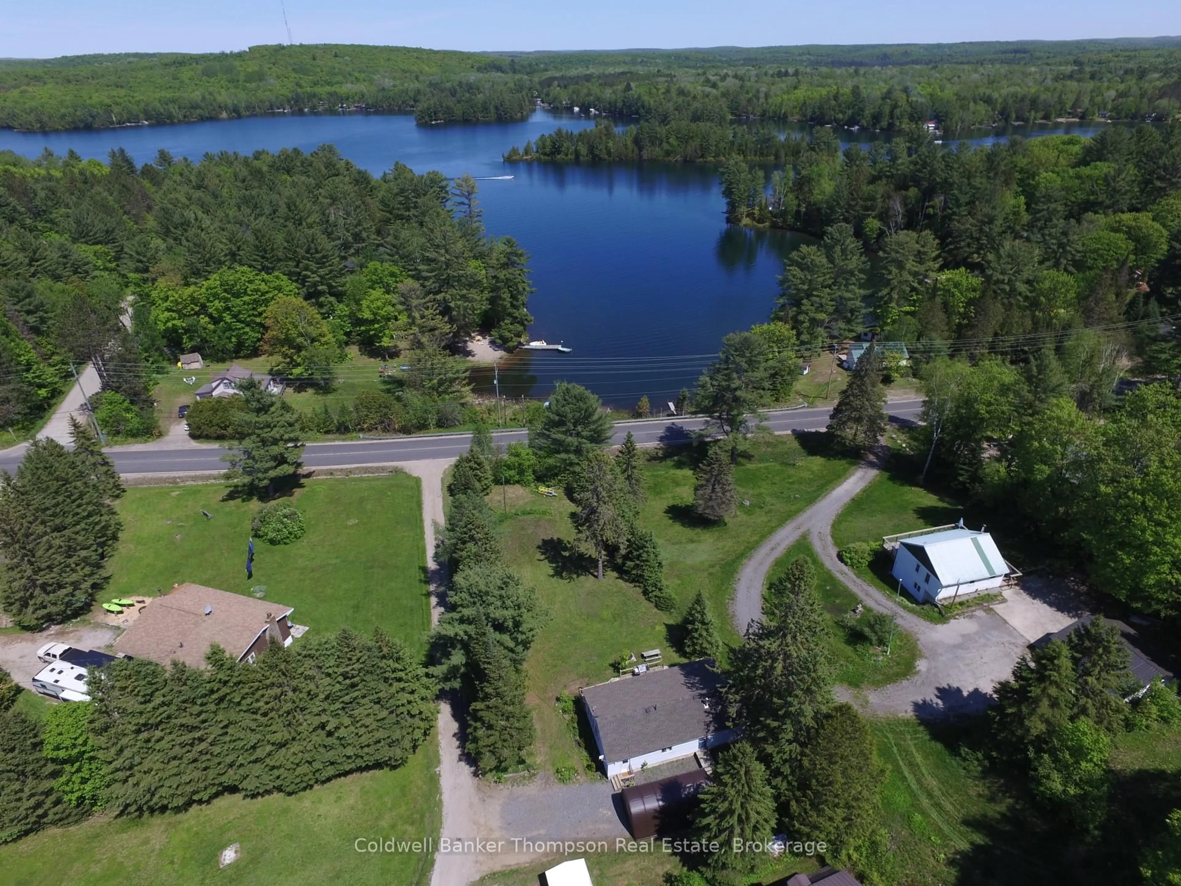 A pic from outside/outdoor area/front of a property/back of a property/a pic from drone, water/lake/river/ocean view for 1116 592 Highway, Perry Ontario P0A 1J0