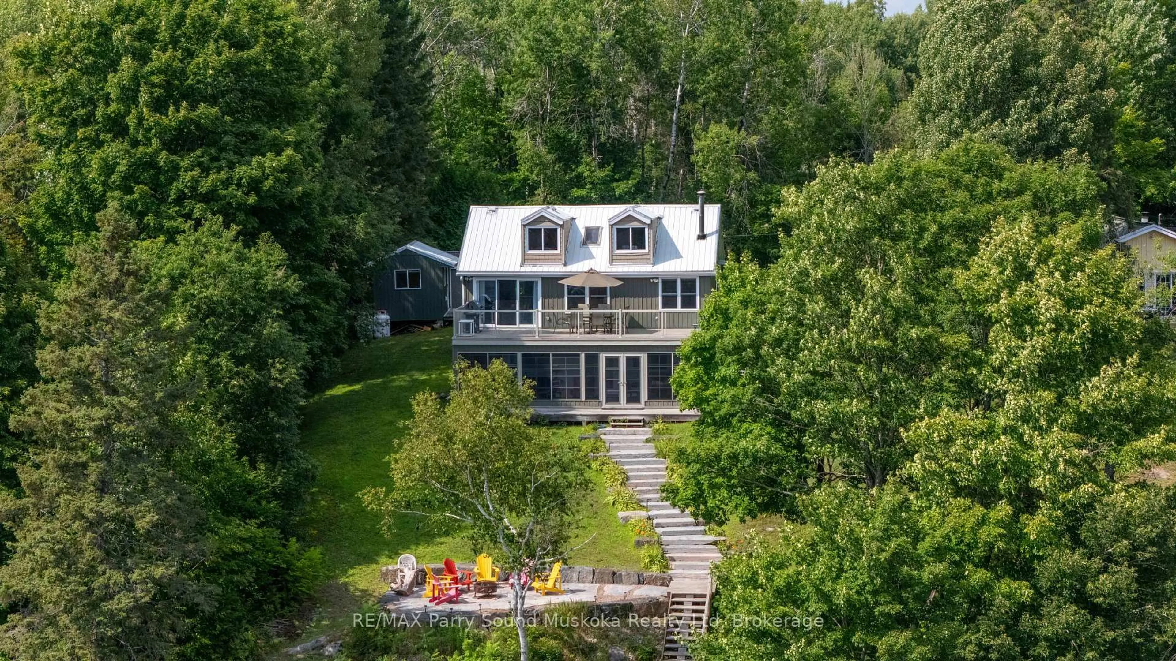 A pic from outside/outdoor area/front of a property/back of a property/a pic from drone, water/lake/river/ocean view for 16 Golden Horseshoe Lane, Whitestone Ontario P0G 1G0