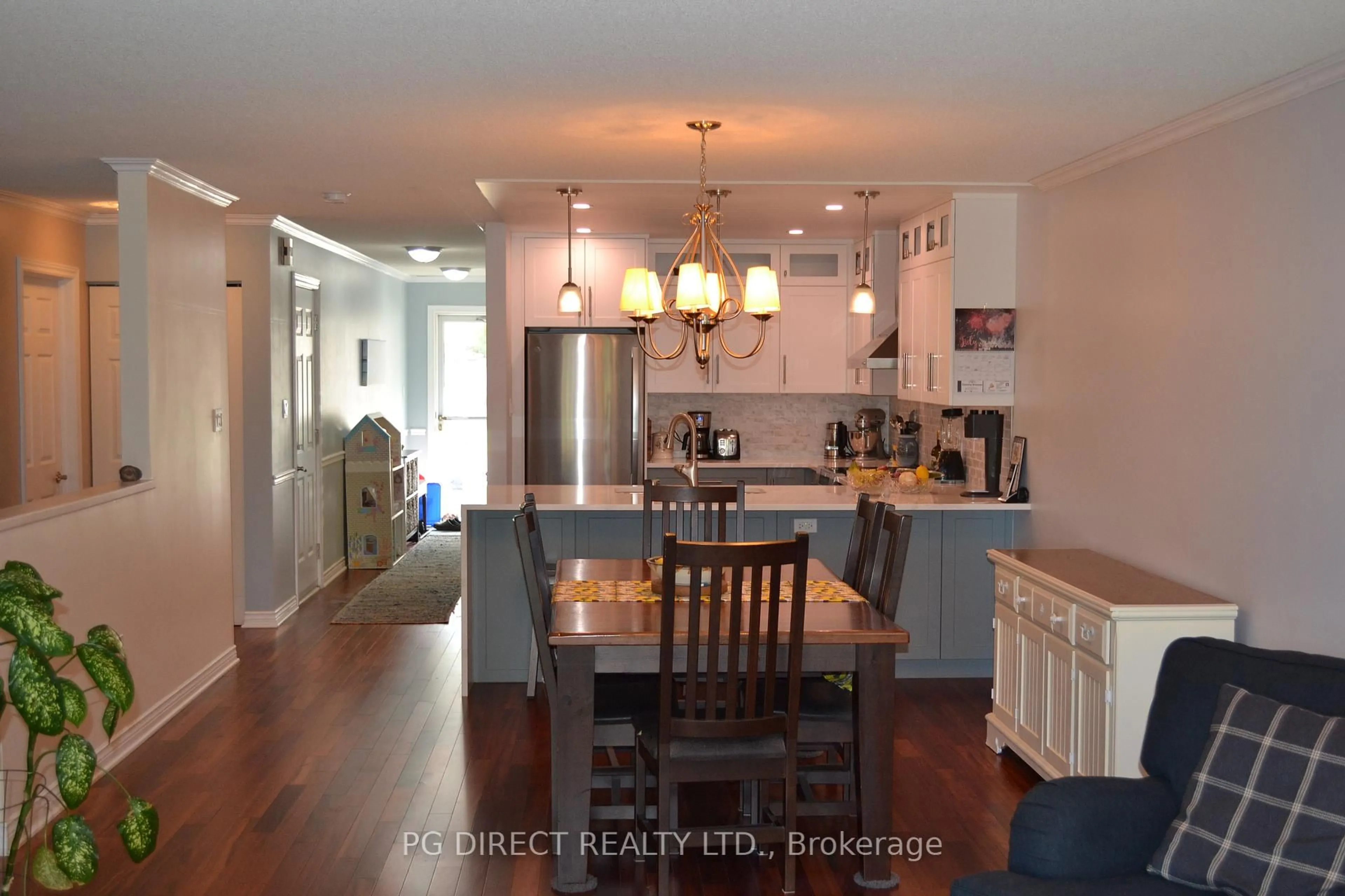 Open concept kitchen, wood/laminate floor for 145 Fairway Dr, Callander Ontario P0H 1H0