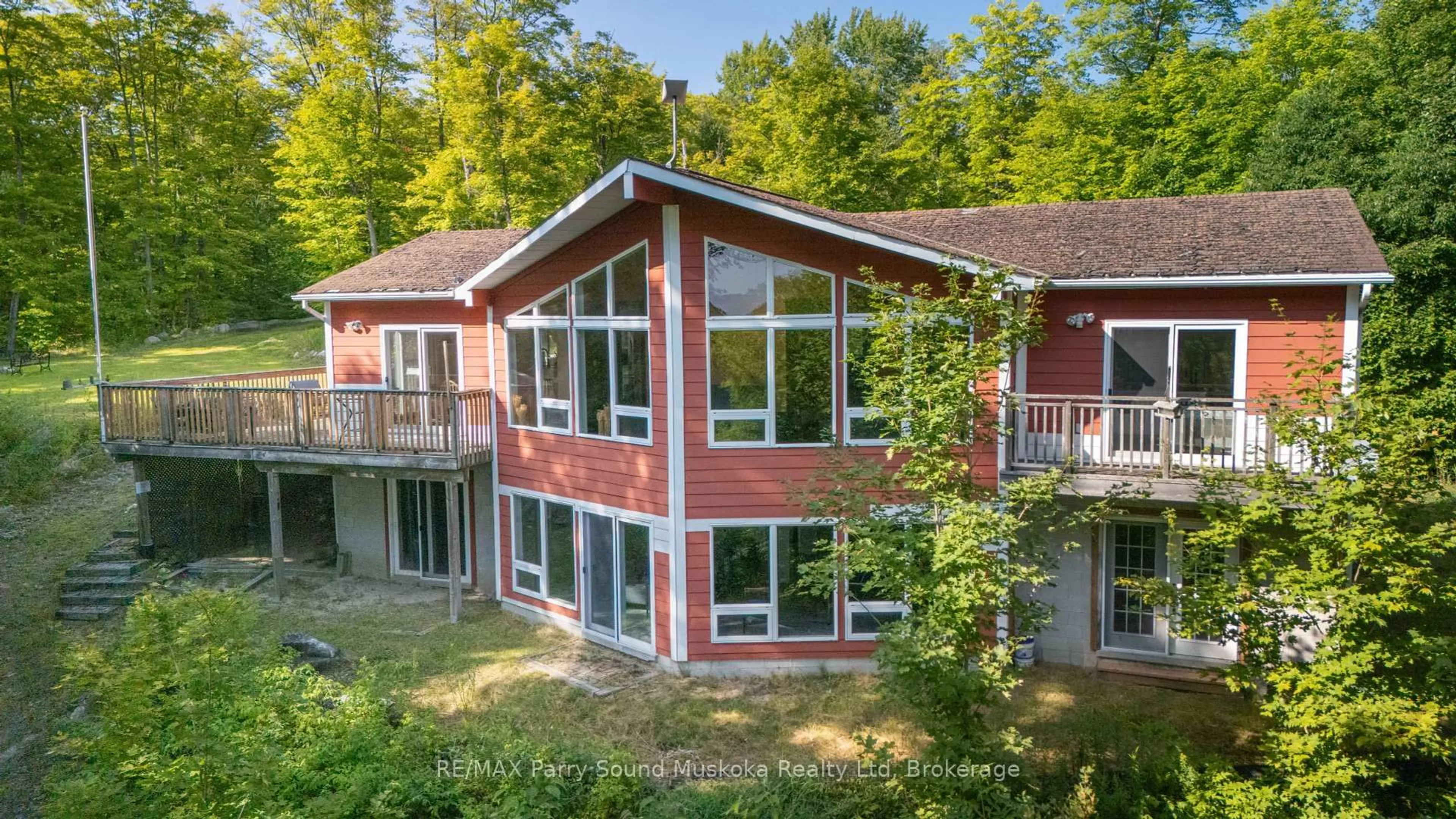 A pic from outside/outdoor area/front of a property/back of a property/a pic from drone, water/lake/river/ocean view for 23 Shady Maple Tr, Whitestone Ontario P0A 1G0