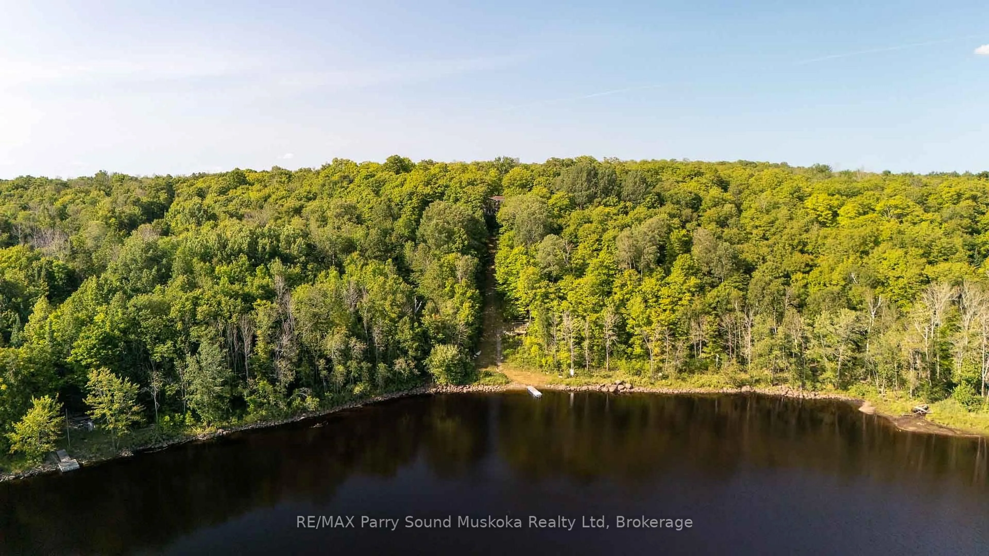 A pic from outside/outdoor area/front of a property/back of a property/a pic from drone, water/lake/river/ocean view for 23 Shady Maple Tr, Whitestone Ontario P0A 1G0
