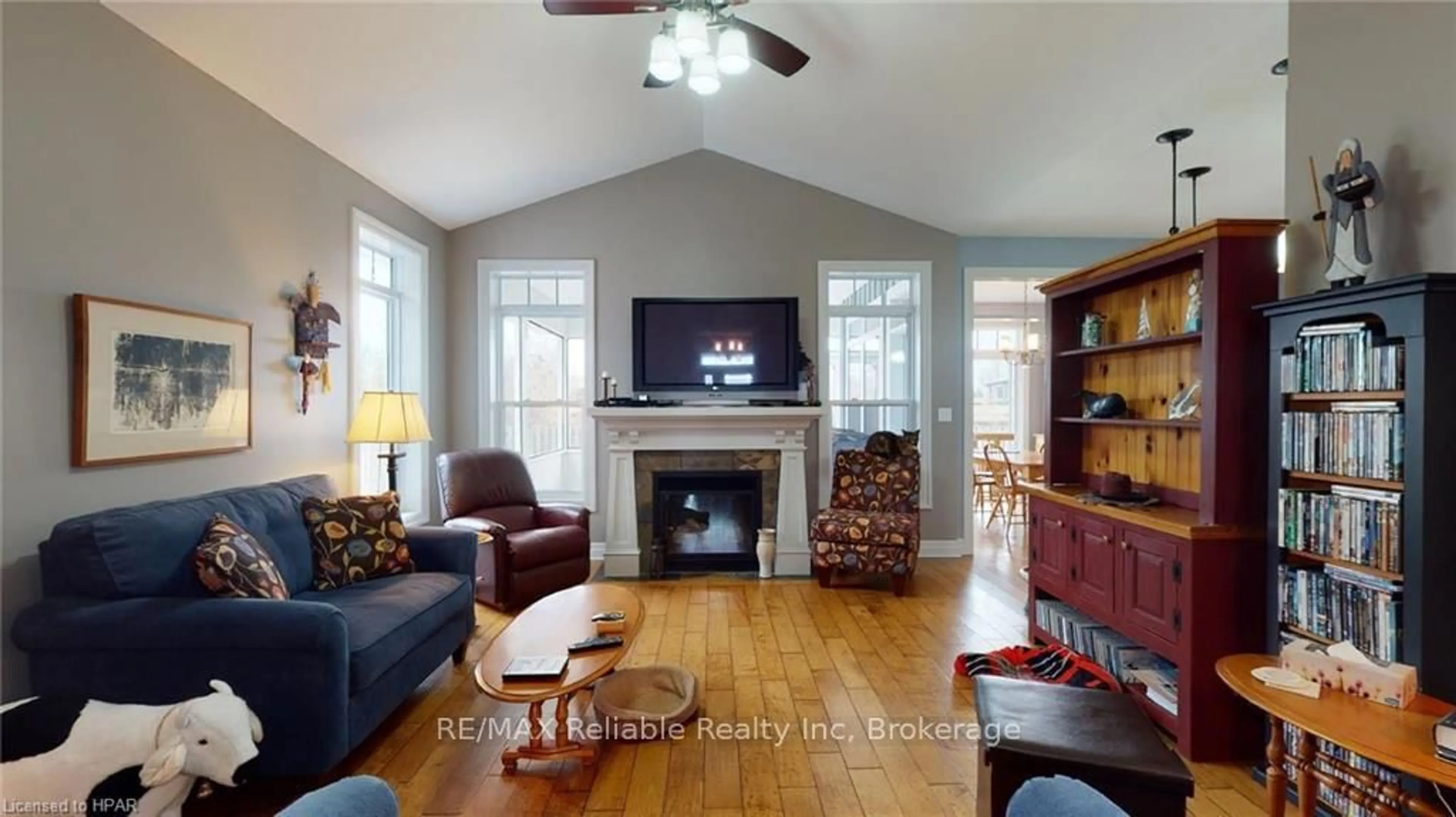 Living room with furniture, wood/laminate floor for 22 Thimbleweed Dr, Bluewater Ontario N0M 1G0