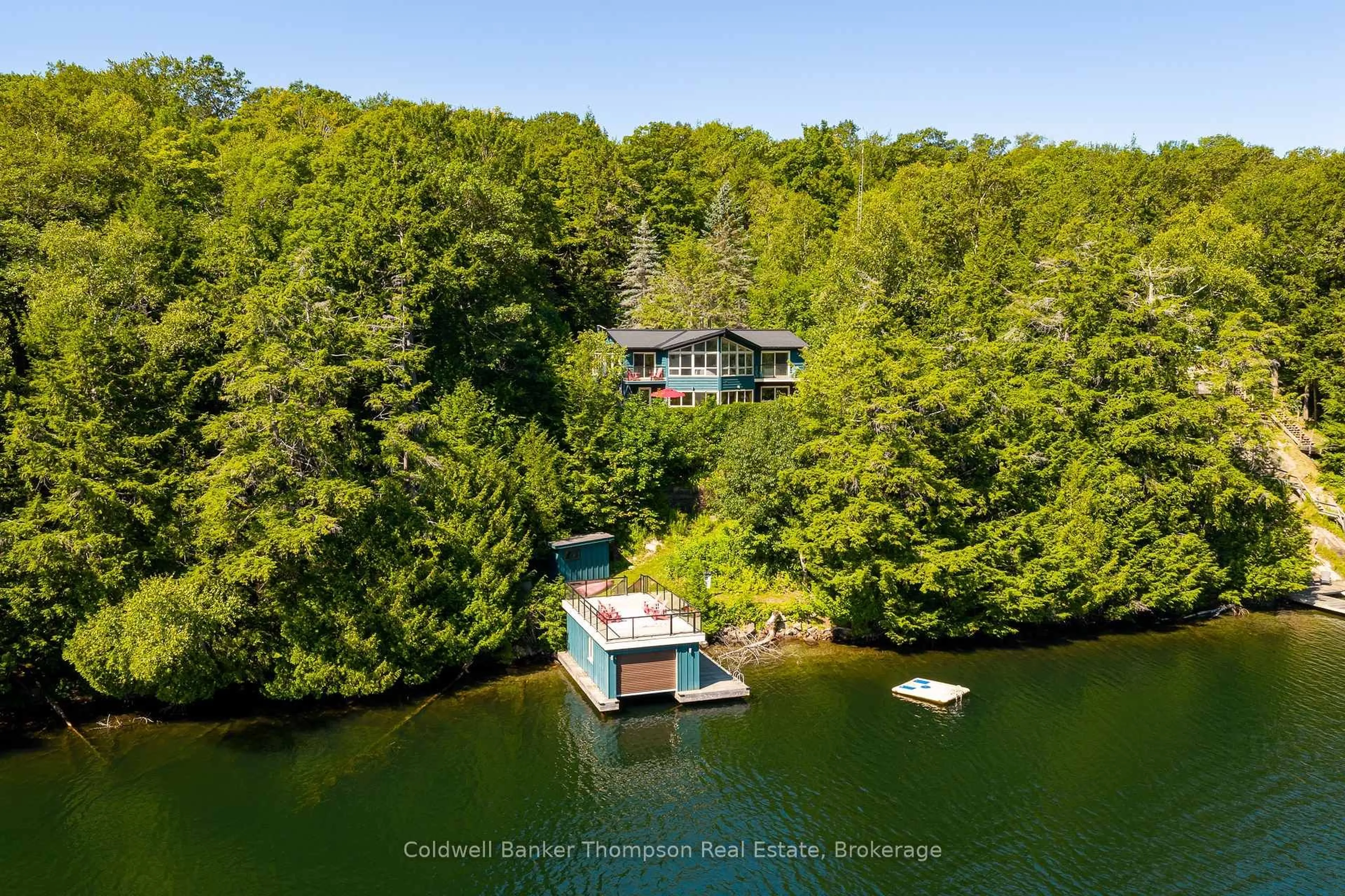 A pic from outside/outdoor area/front of a property/back of a property/a pic from drone, water/lake/river/ocean view for 1063 Lakeview Rd, Muskoka Lakes Ontario P0B 1M0
