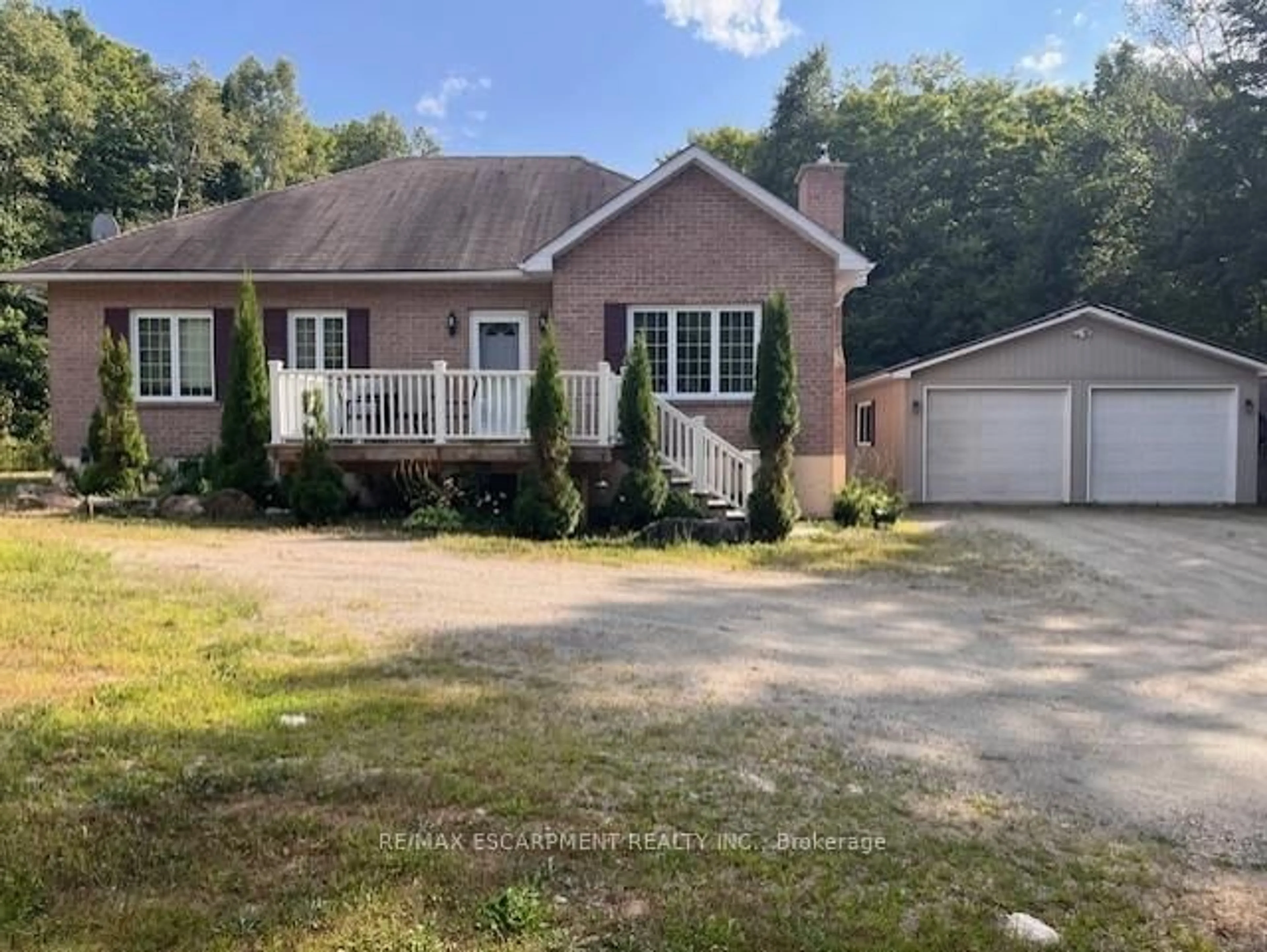 A pic from outside/outdoor area/front of a property/back of a property/a pic from drone, street for 17182 Highway 118, Highlands East Ontario K0M 1S0