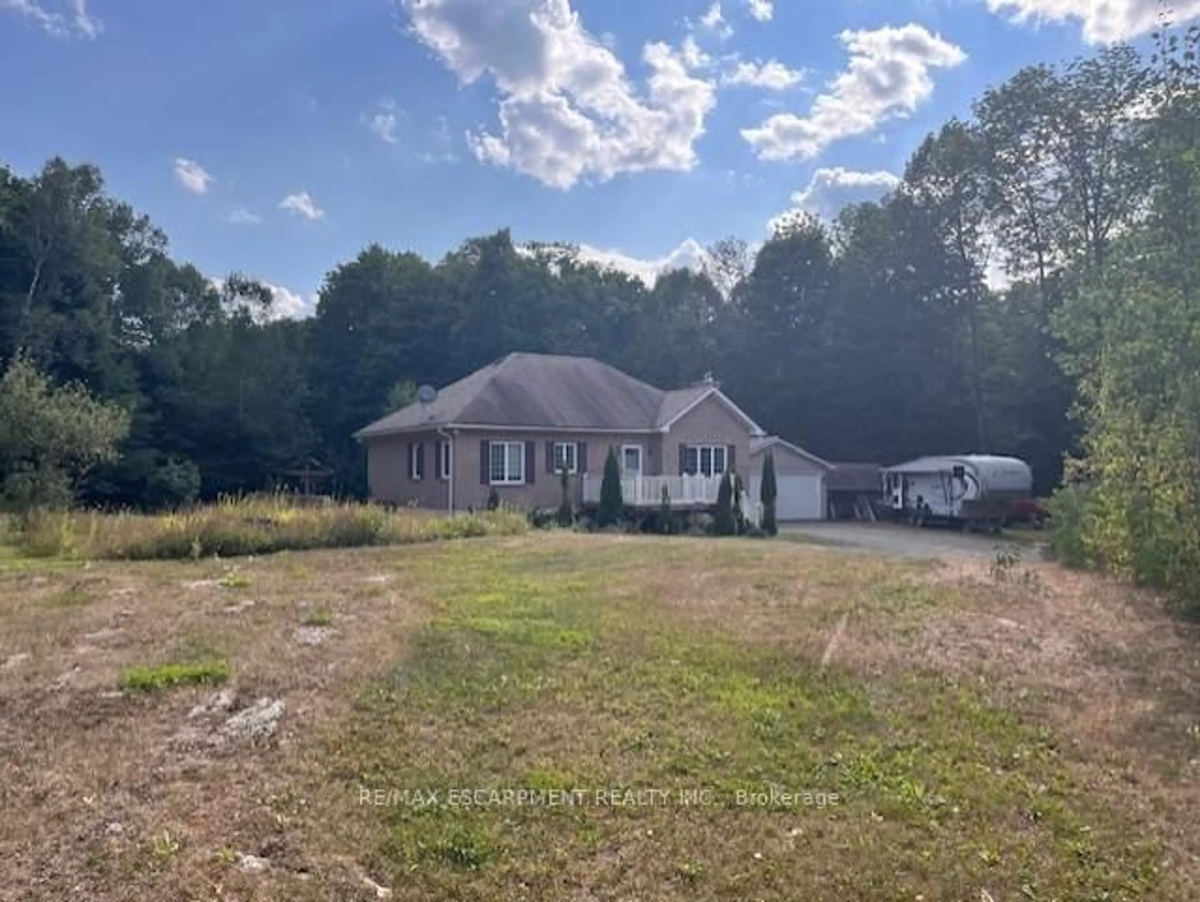 A pic from outside/outdoor area/front of a property/back of a property/a pic from drone, unknown for 17182 Highway 118, Highlands East Ontario K0M 1S0