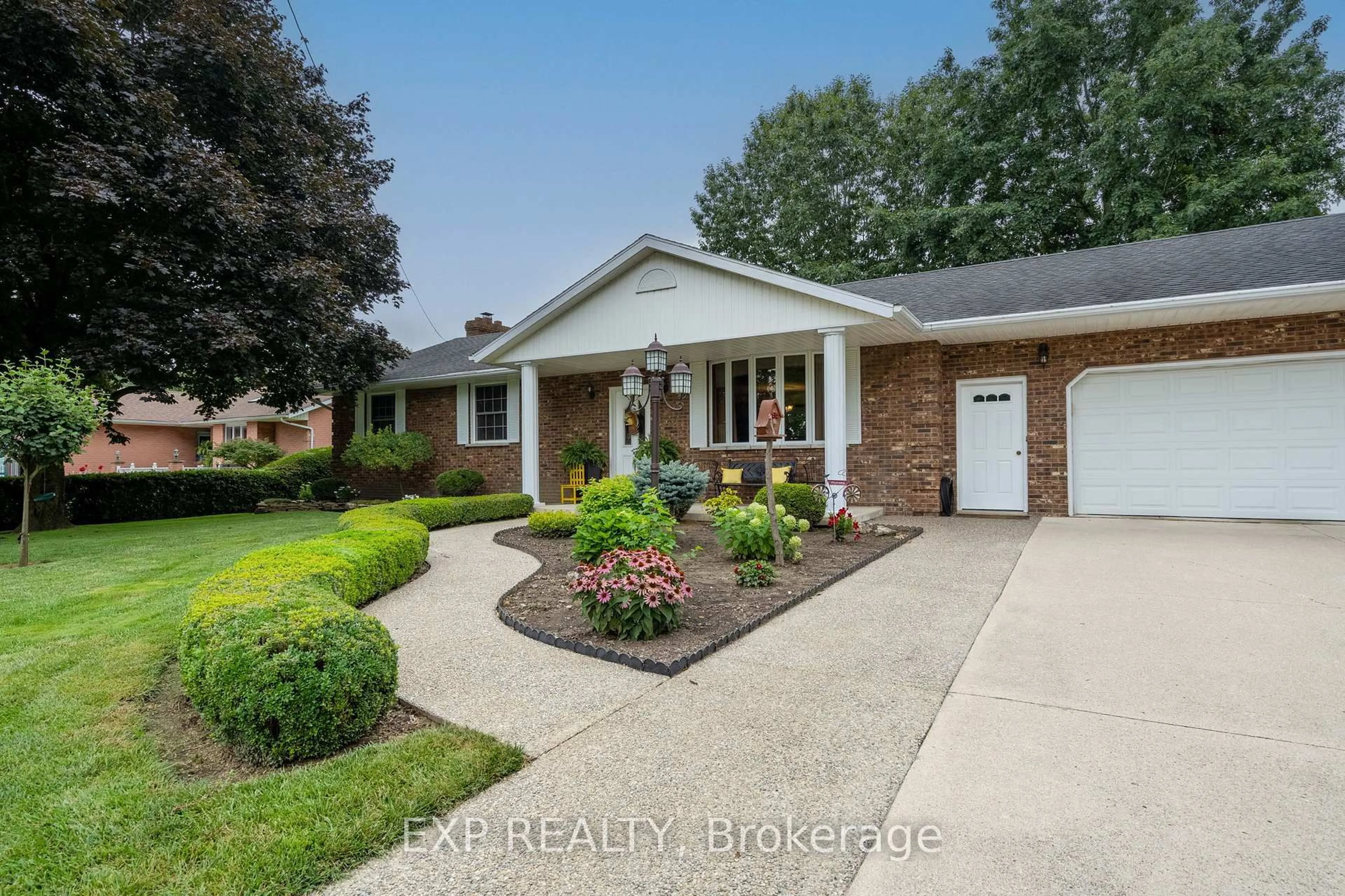 Home with brick exterior material, street for 23067 Pioneer Line, West Elgin Ontario N0L 2C0