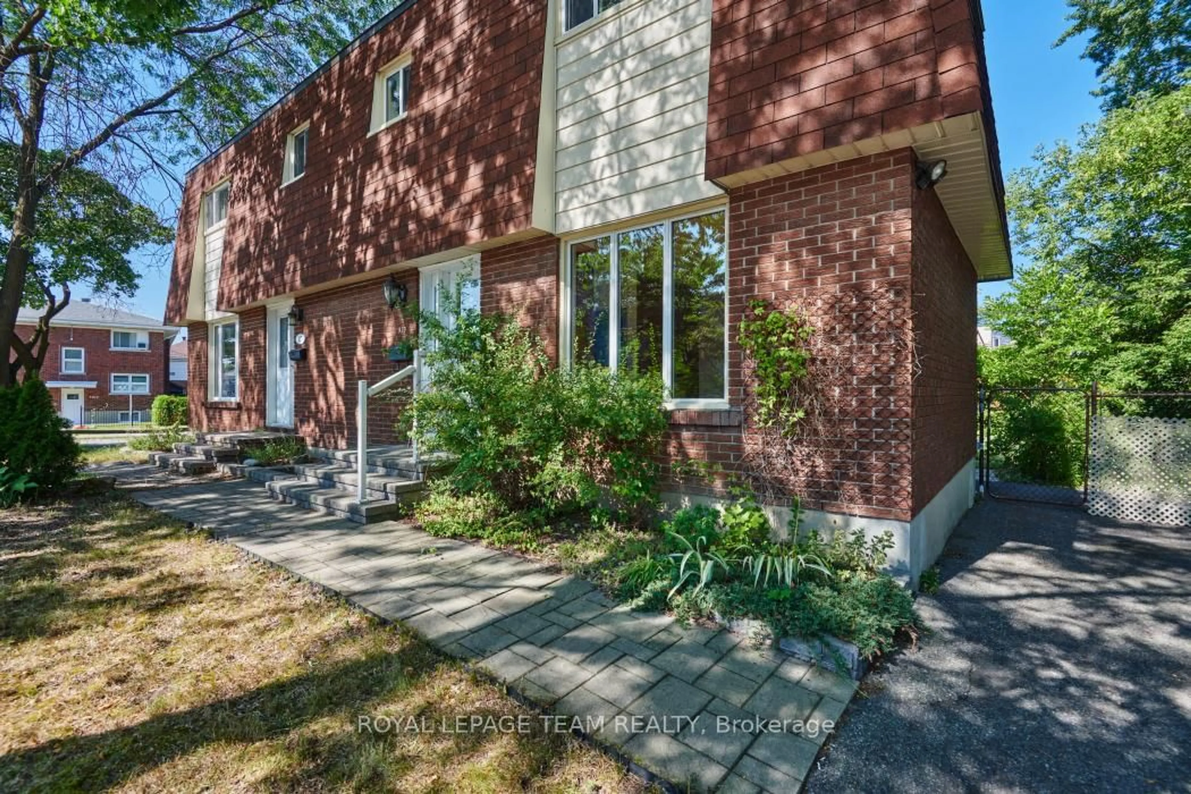 Home with brick exterior material, street for 939 Kirkwood Ave, Ottawa Ontario K1Z 8N1