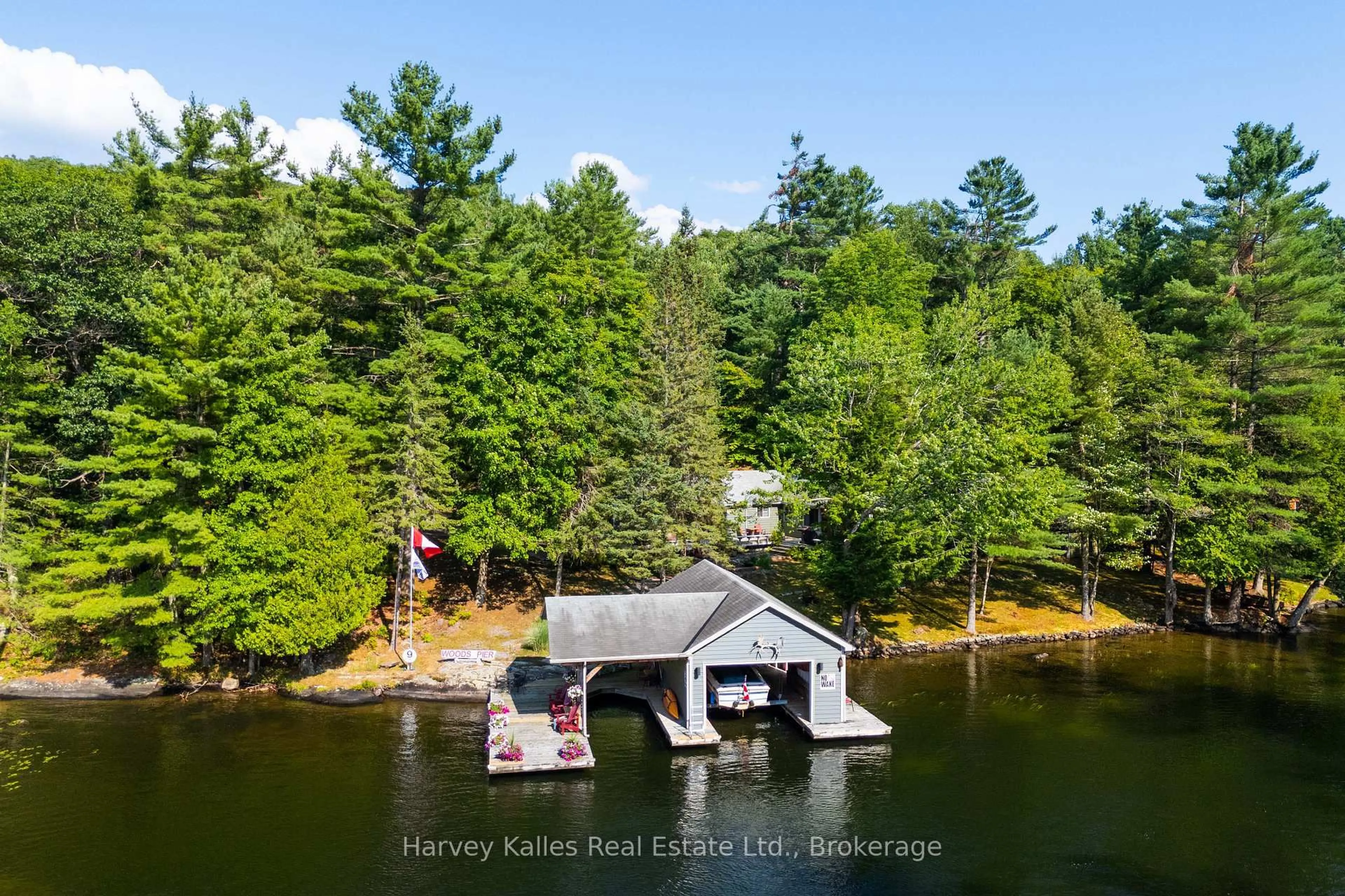 A pic from outside/outdoor area/front of a property/back of a property/a pic from drone, water/lake/river/ocean view for 1205 Joe River Rd #6, Muskoka Lakes Ontario P0B 1G0