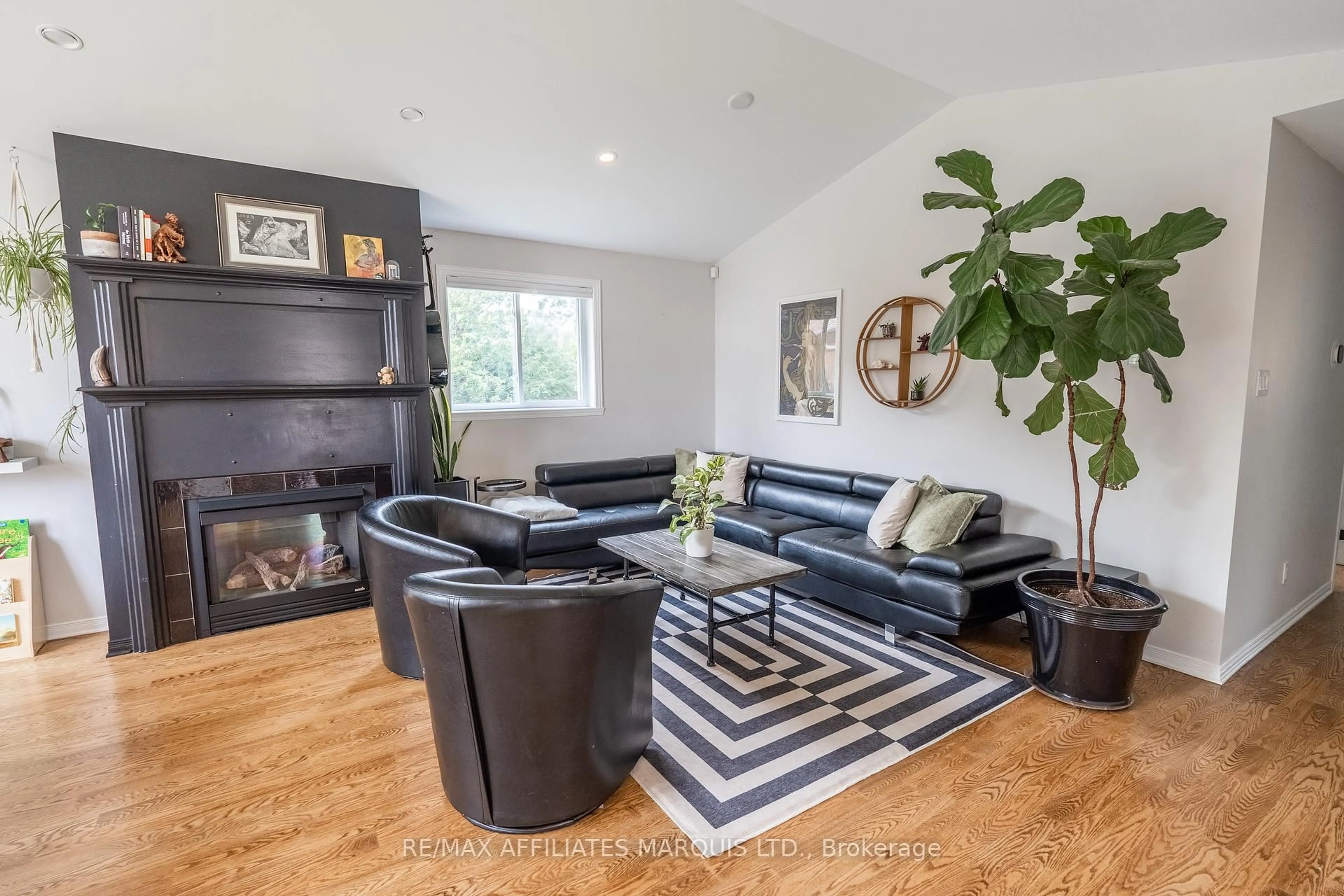 Living room with furniture, wood/laminate floor for 1161 Kirkman Crt, Cornwall Ontario K6H 5E2