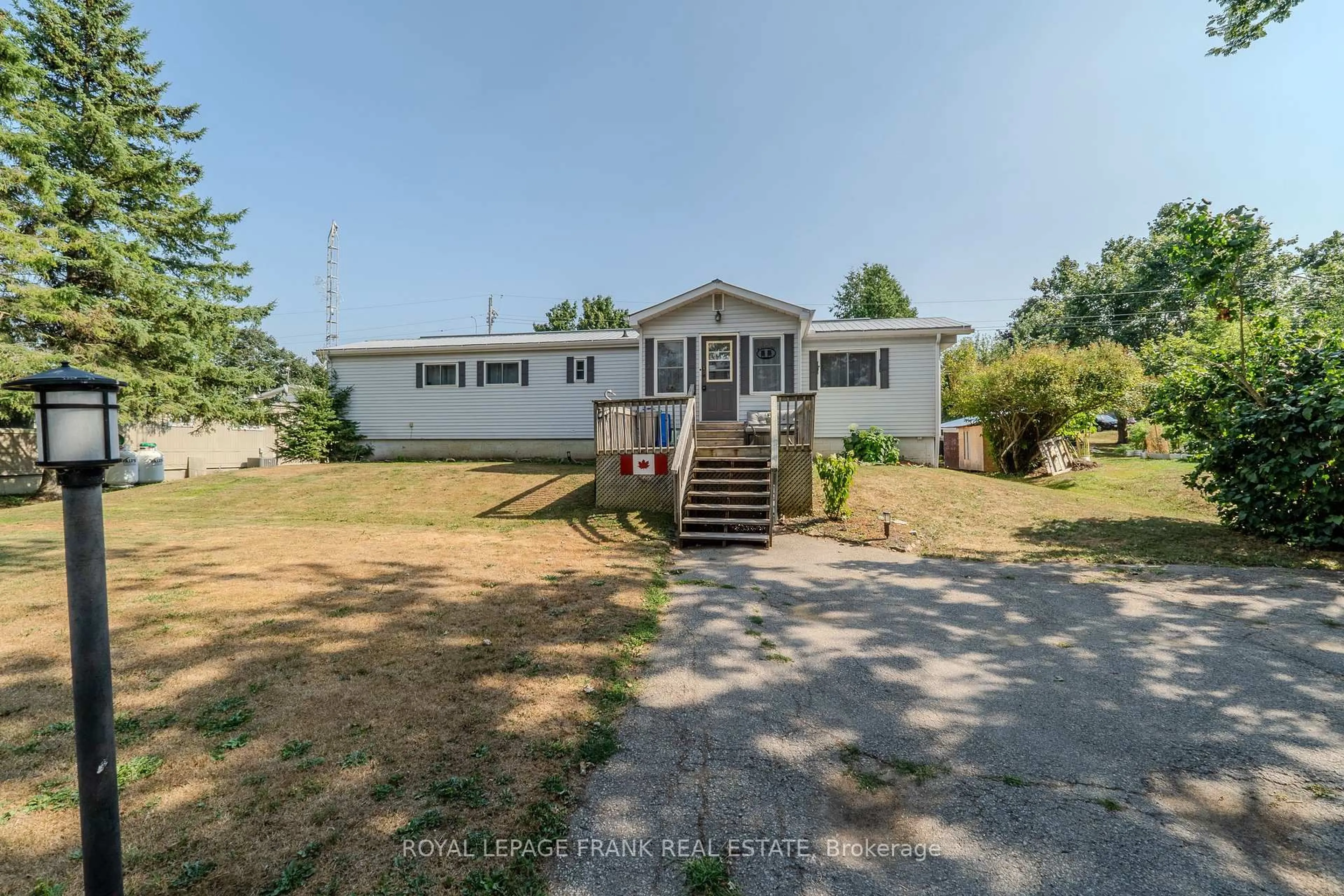 A pic from outside/outdoor area/front of a property/back of a property/a pic from drone, water/lake/river/ocean view for 10 Fenelon Way, Kawartha Lakes Ontario K9V 0H5