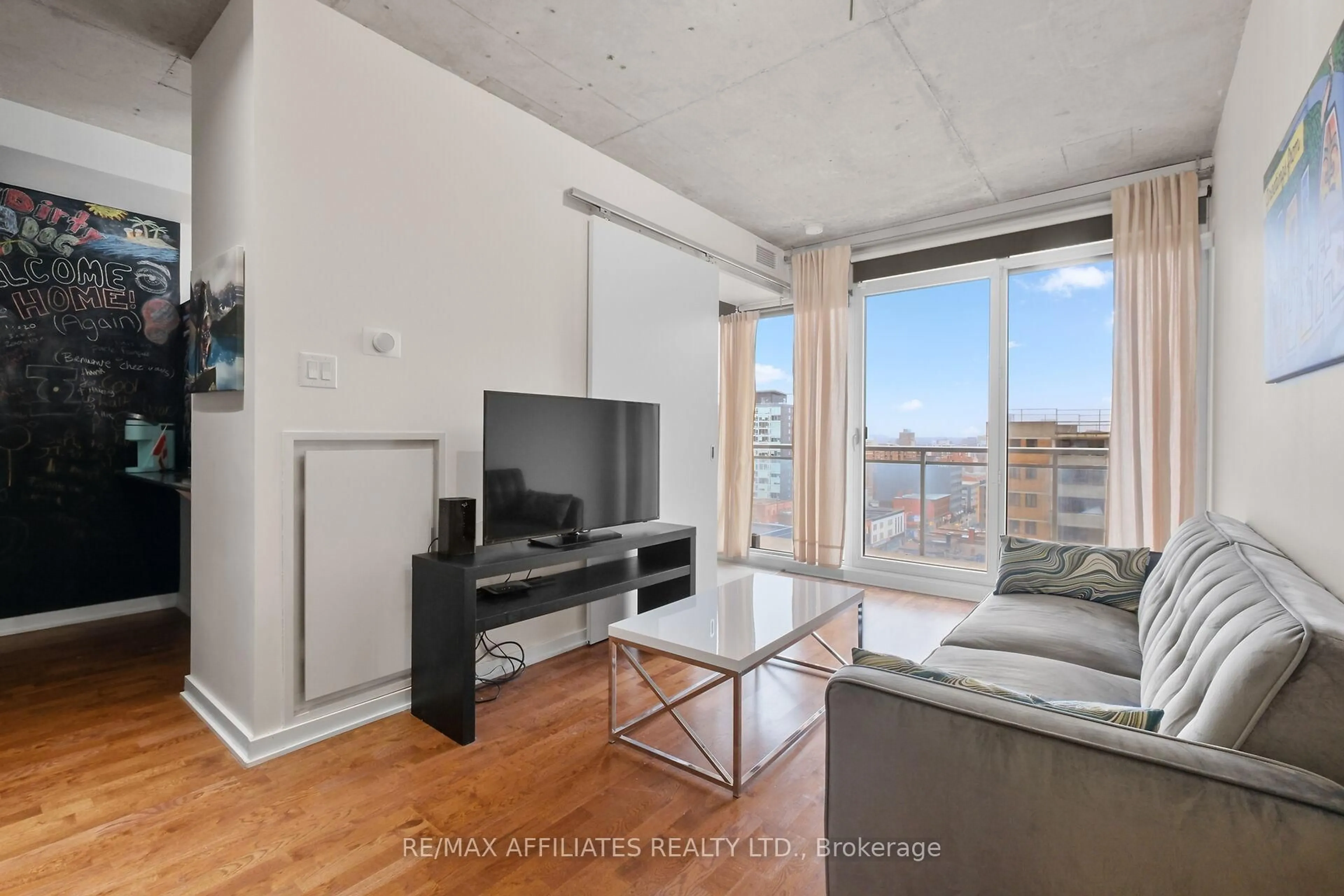 Living room with furniture, unknown for 324 Laurier Ave #1201, Ottawa Ontario K1N 6P6