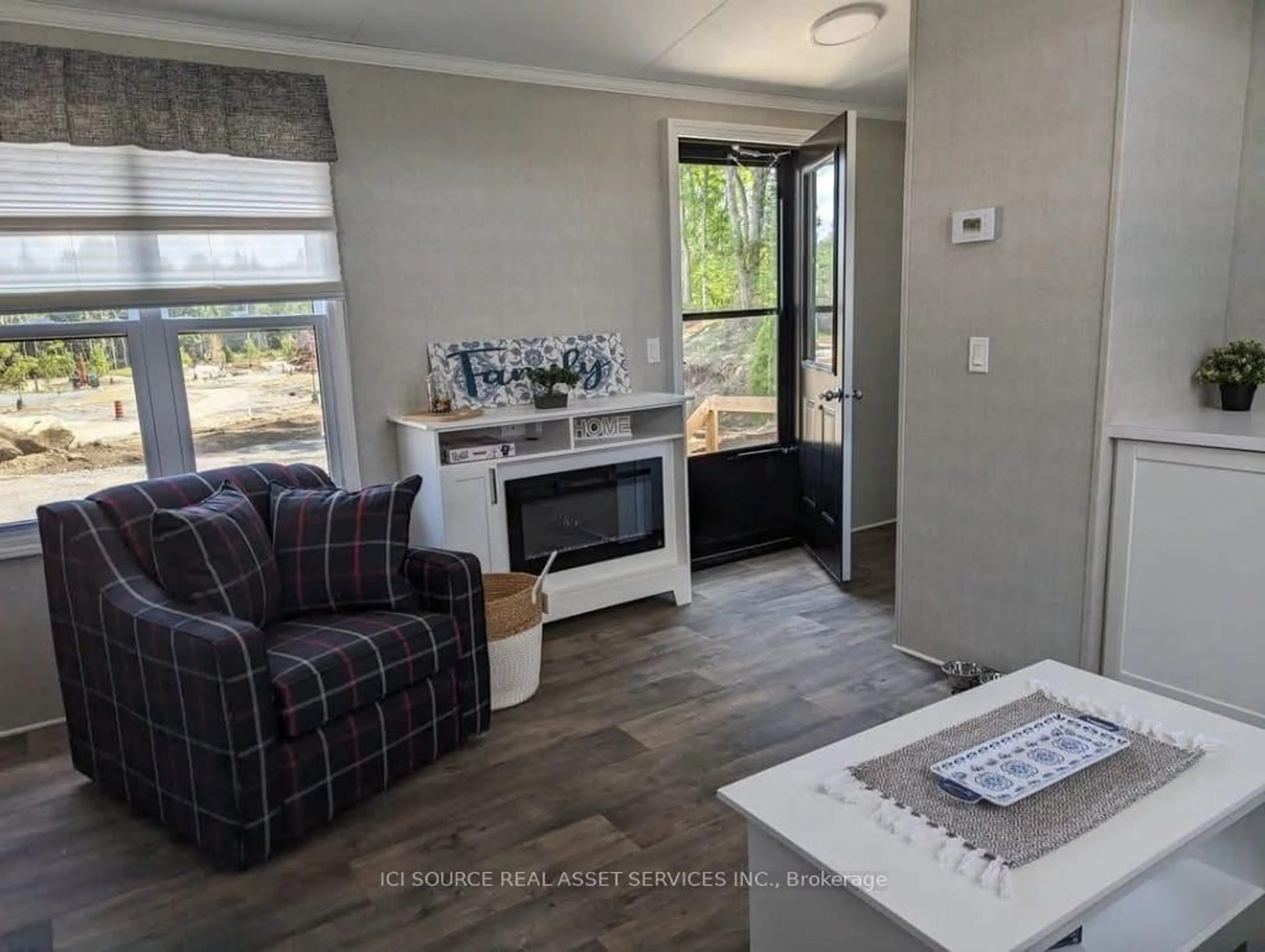 Living room with furniture, unknown for 1047 Bonnie Lake Camp Rd #LKR036, Bracebridge Ontario P1L 1W9