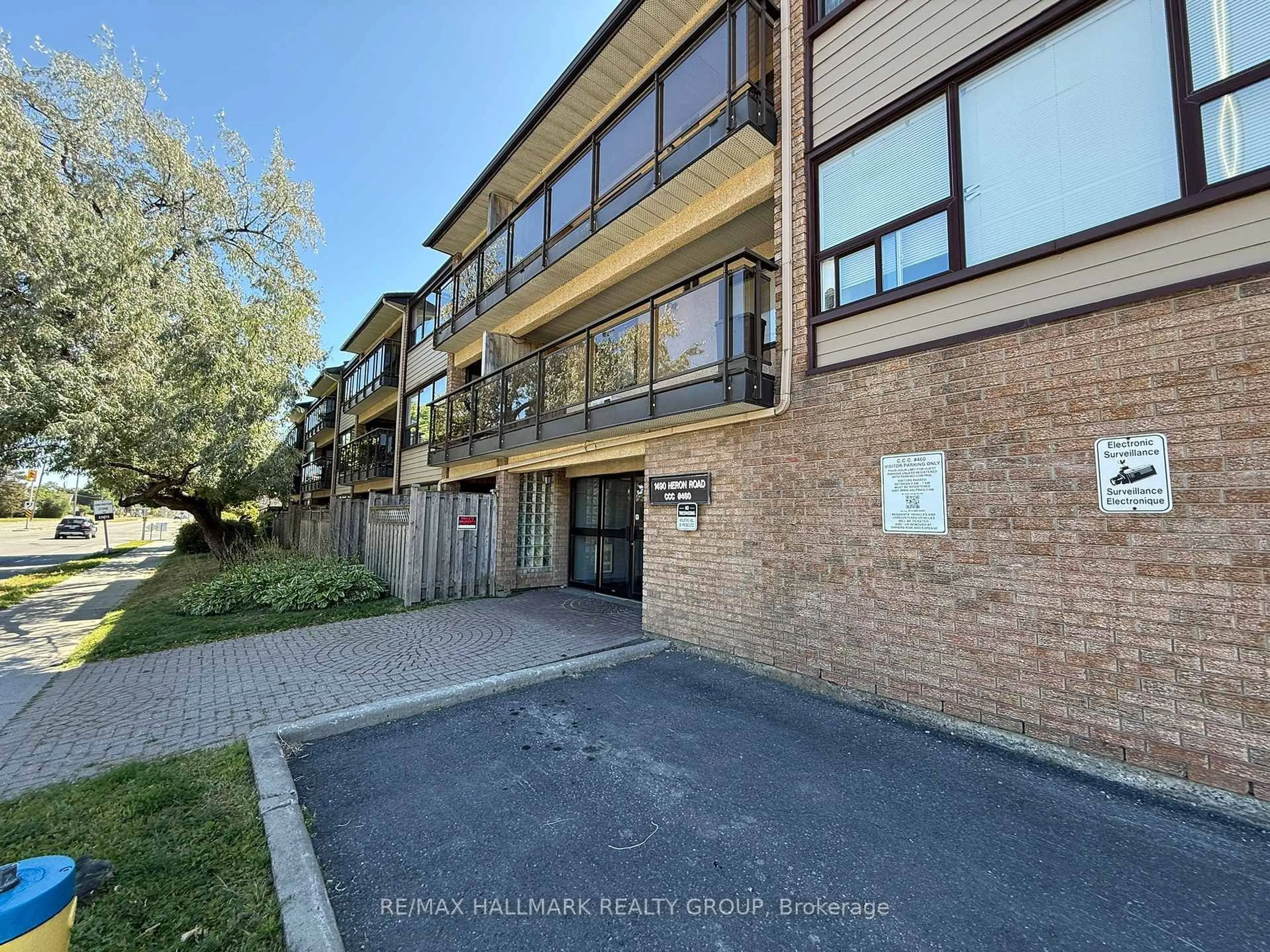 A pic from outside/outdoor area/front of a property/back of a property/a pic from drone, unknown for 1490 Heron Rd #202, Ottawa Ontario K1V 6A5