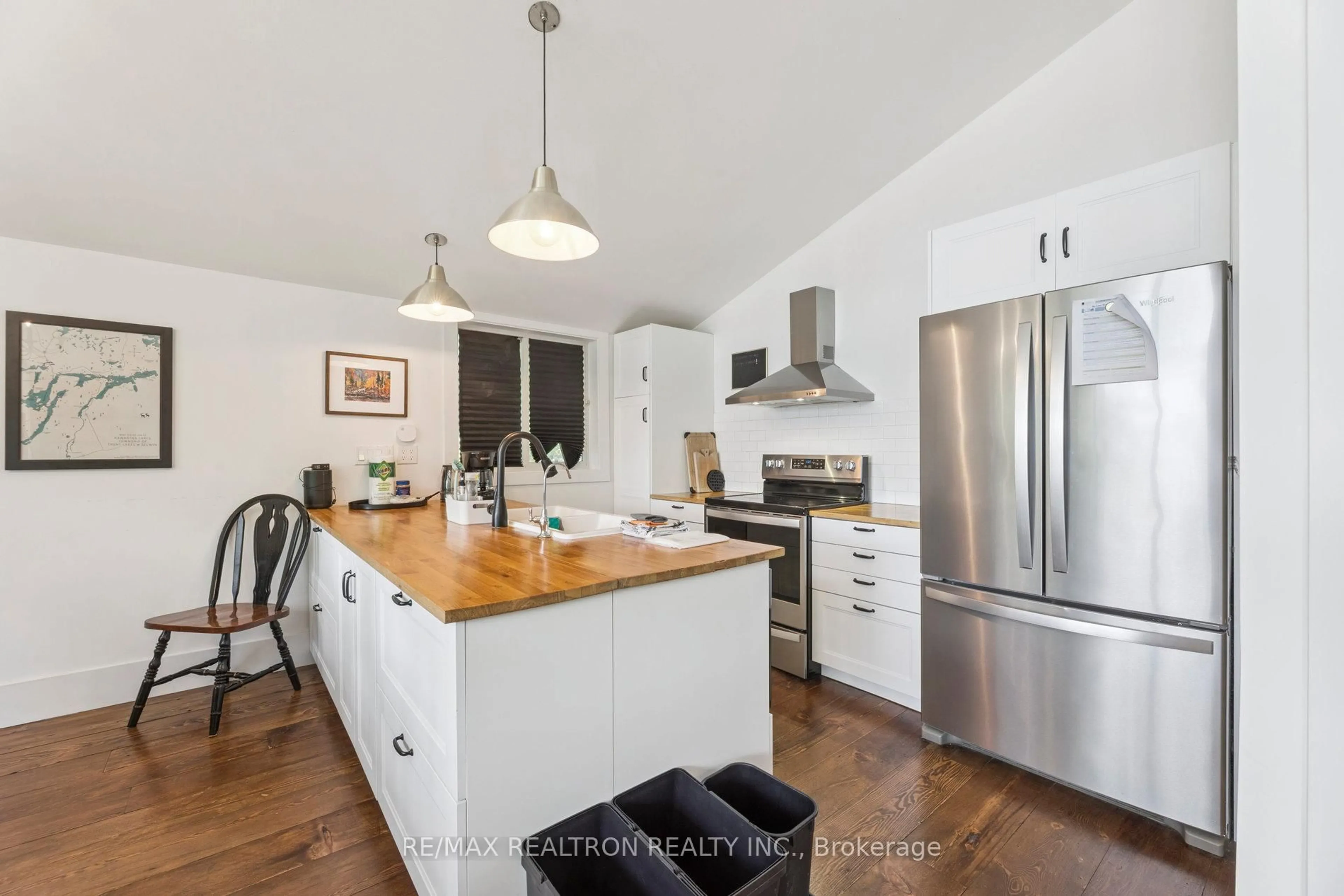 Open concept kitchen, wood/laminate floor for 383 Philrick Dr, Trent Lakes Ontario K0L 1J0