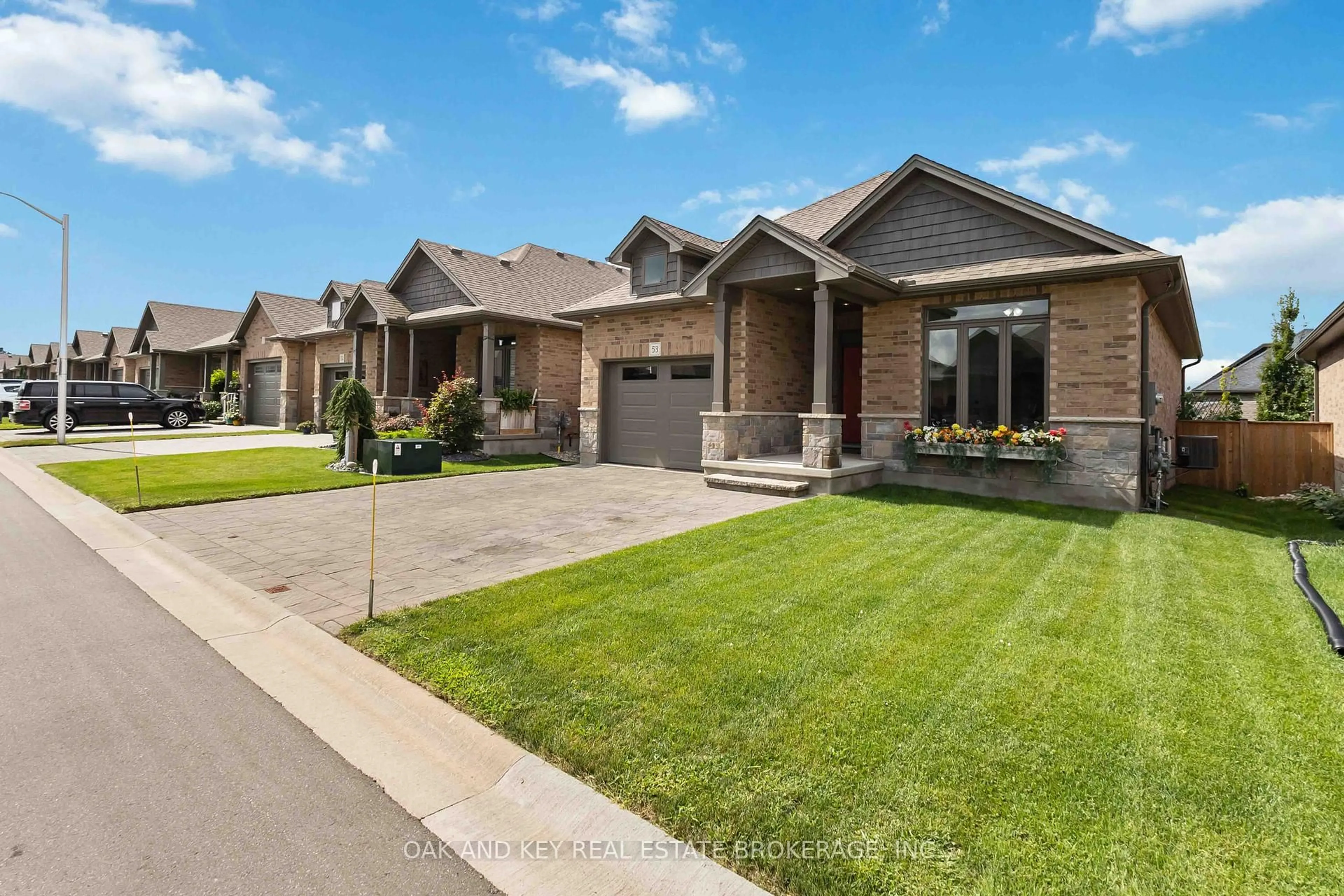 Home with brick exterior material, street for 159 Collins Way #53, Strathroy-Caradoc Ontario N7G 0G8
