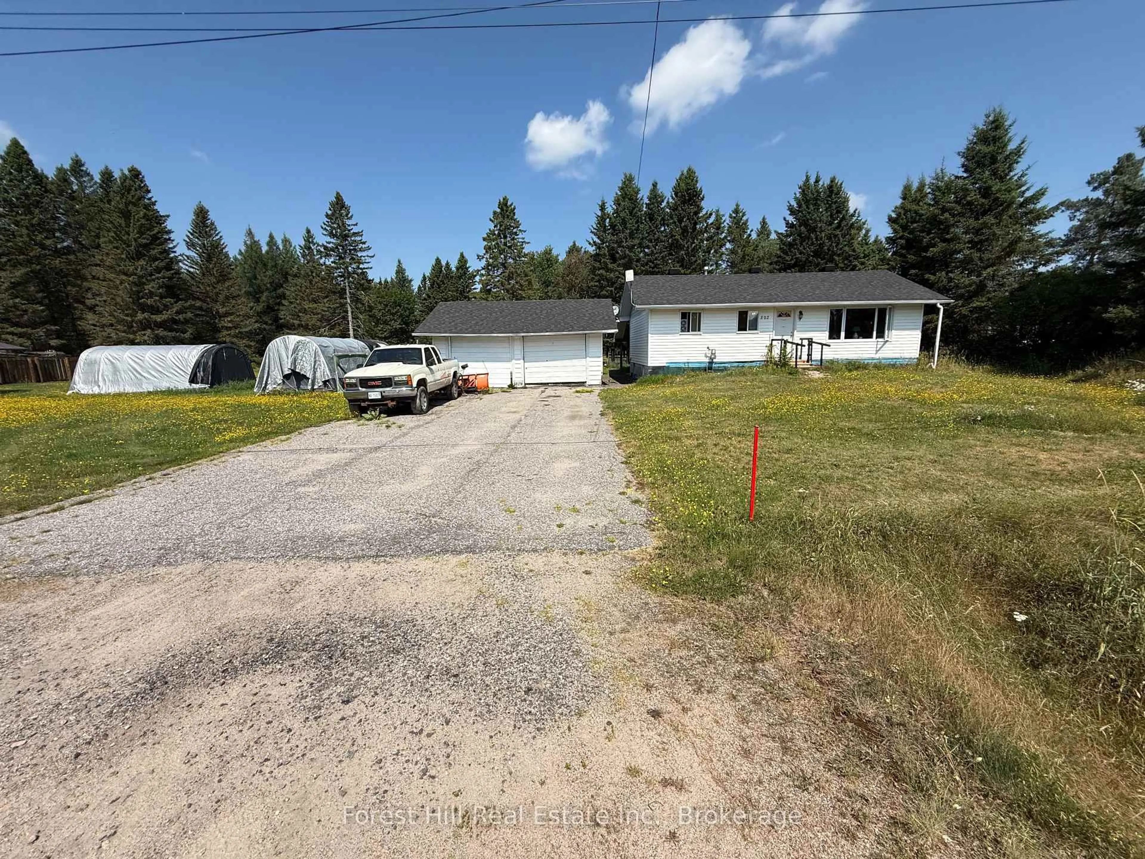 A pic from outside/outdoor area/front of a property/back of a property/a pic from drone, street for 502 Sweezy St, Powassan Ontario P0H 2L0