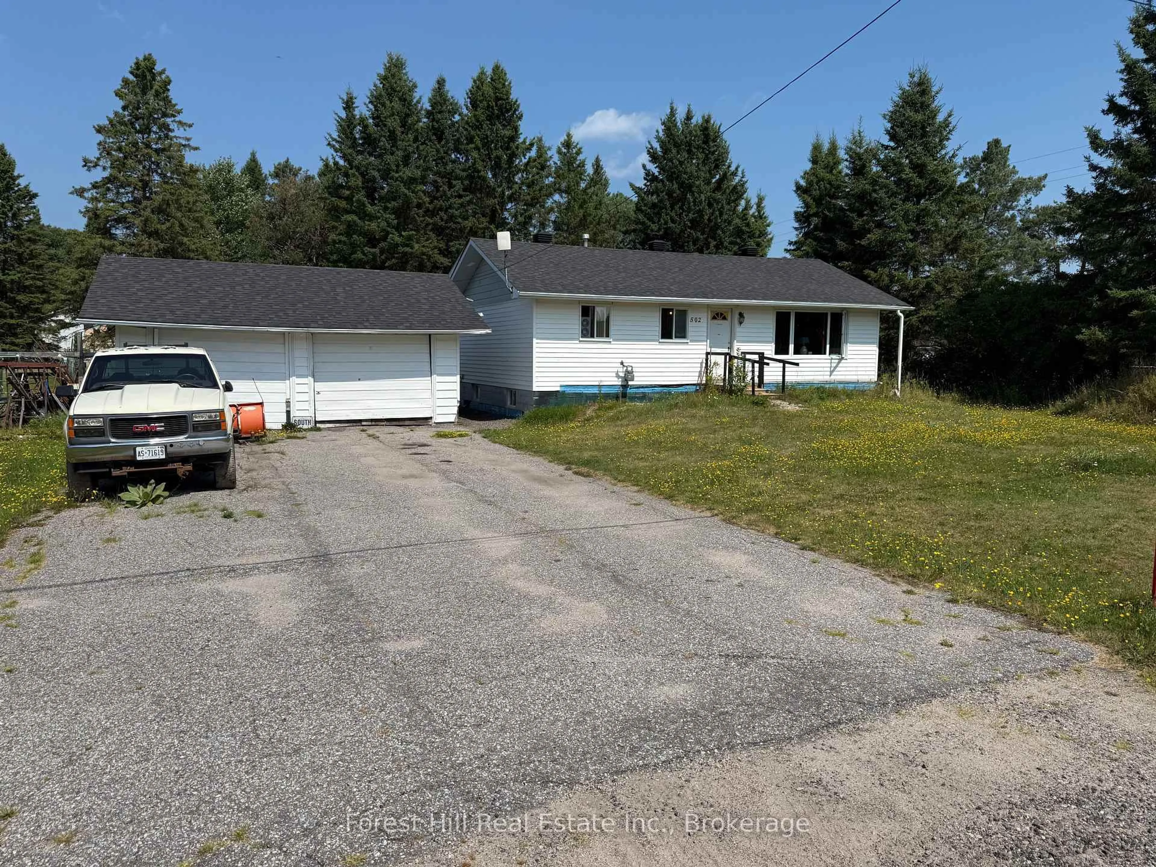 A pic from outside/outdoor area/front of a property/back of a property/a pic from drone, street for 502 Sweezy St, Powassan Ontario P0H 2L0