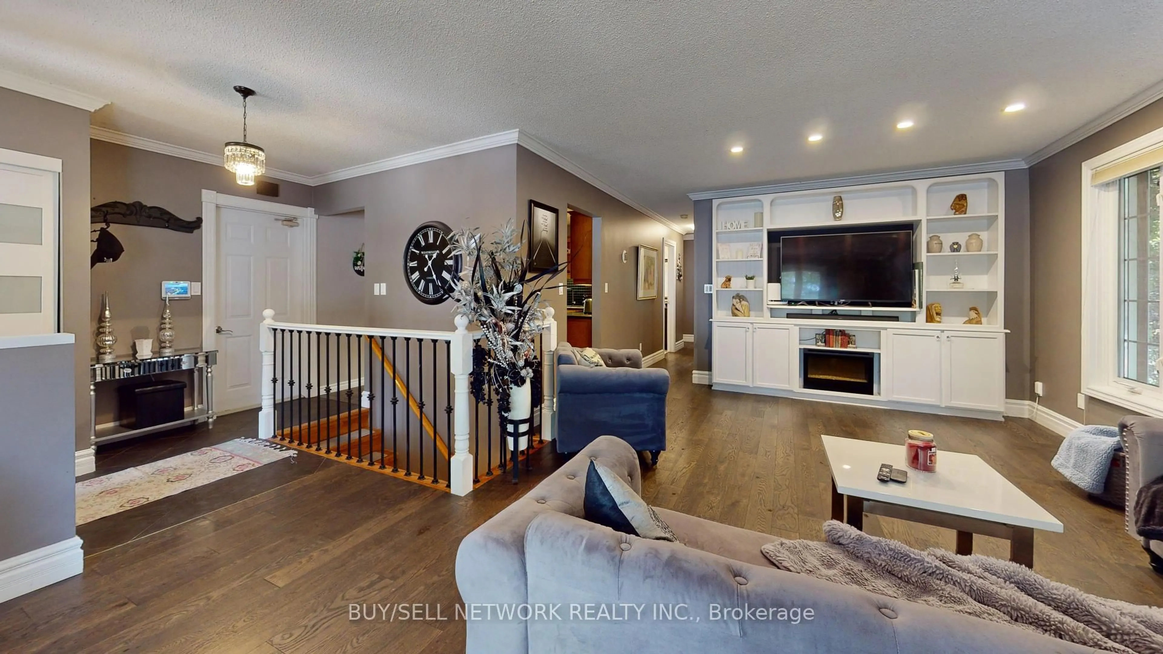 Living room with furniture, wood/laminate floor for 2504 Idyllwood Cres, Peterborough East Ontario K9L 1Y9