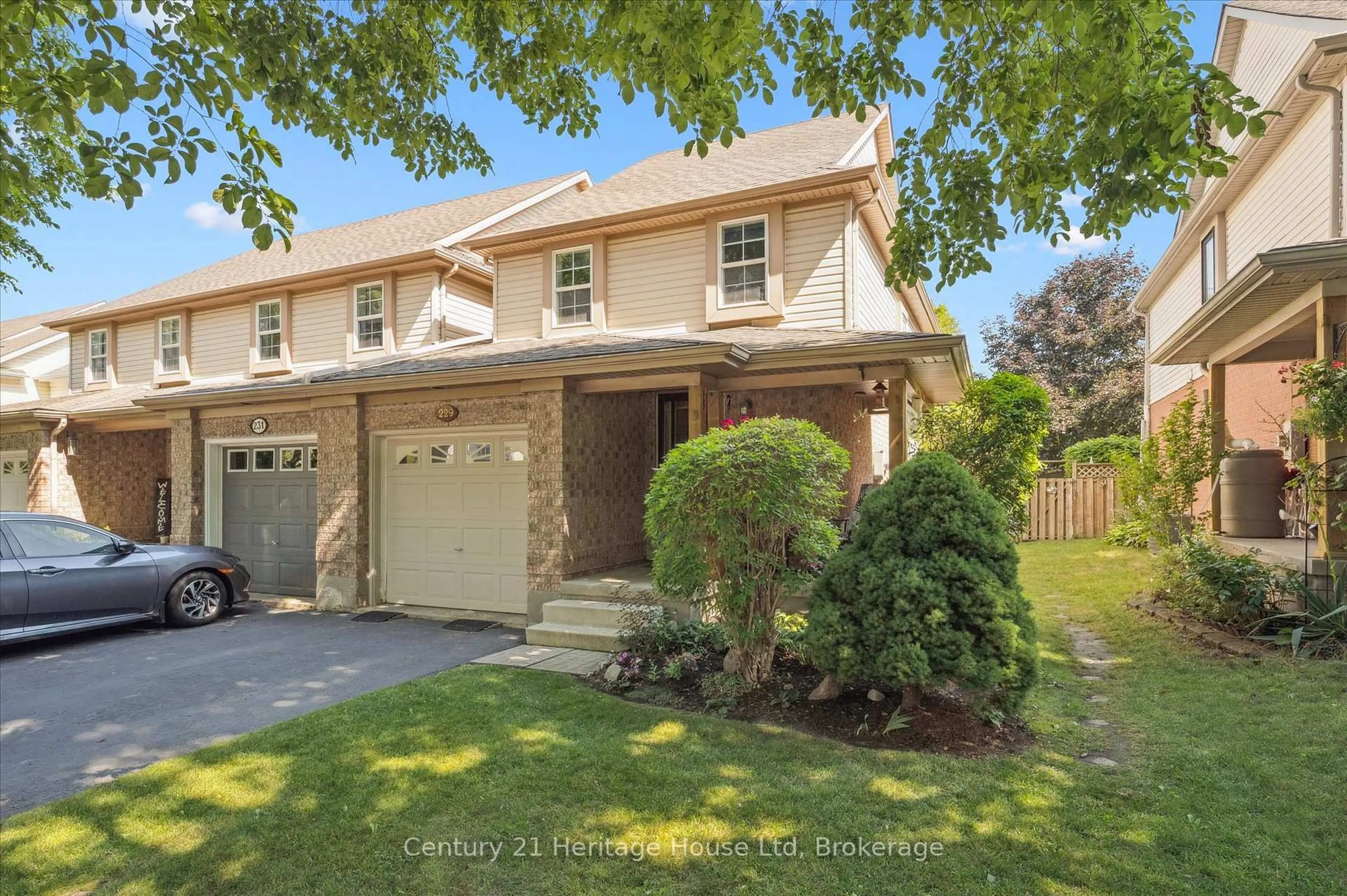 Home with brick exterior material, street for 229 Silurian Dr, Guelph Ontario N1E 7B8