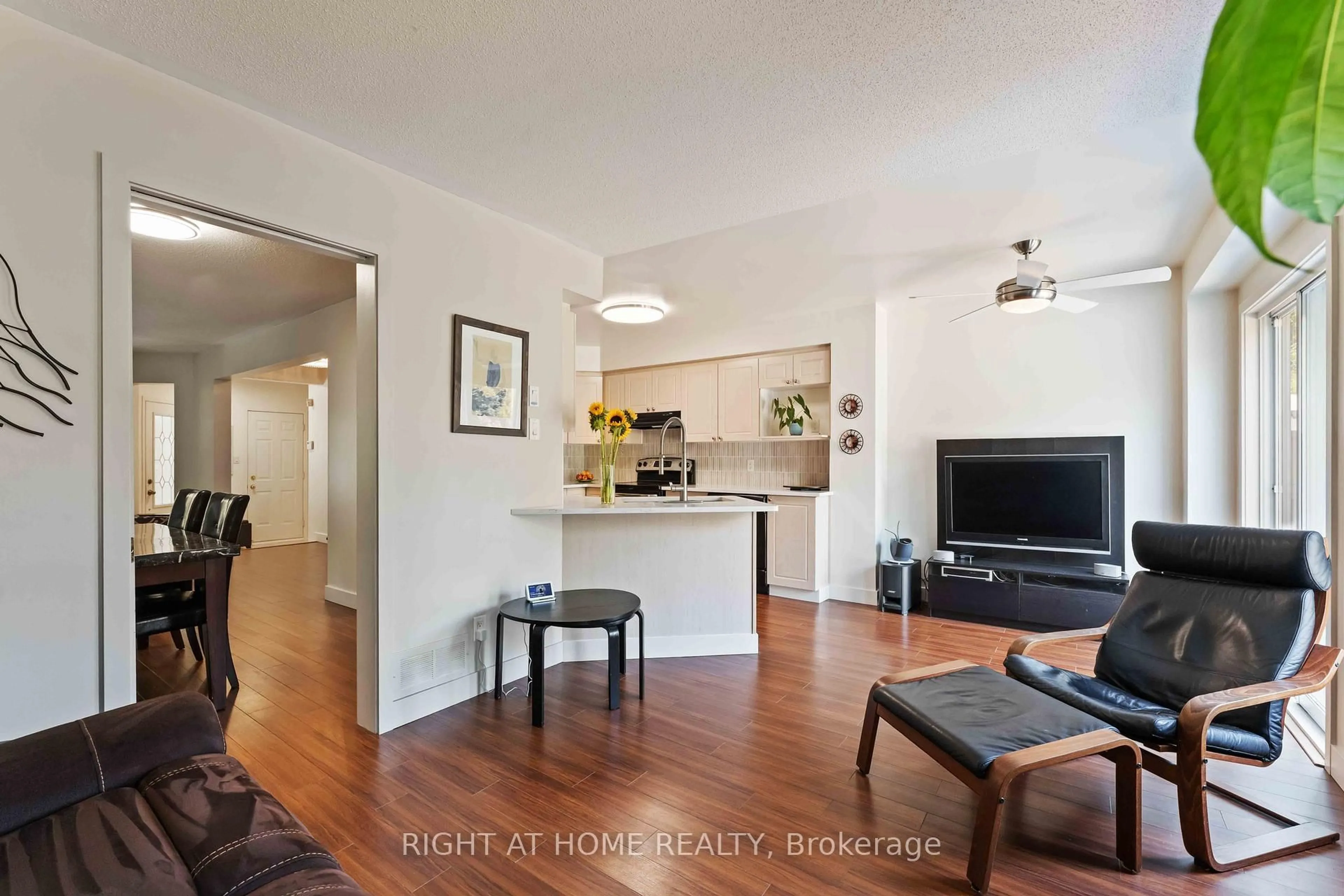 Living room with furniture, wood/laminate floor for 142 Blackdome Cres, Kanata Ontario K2T 1A7