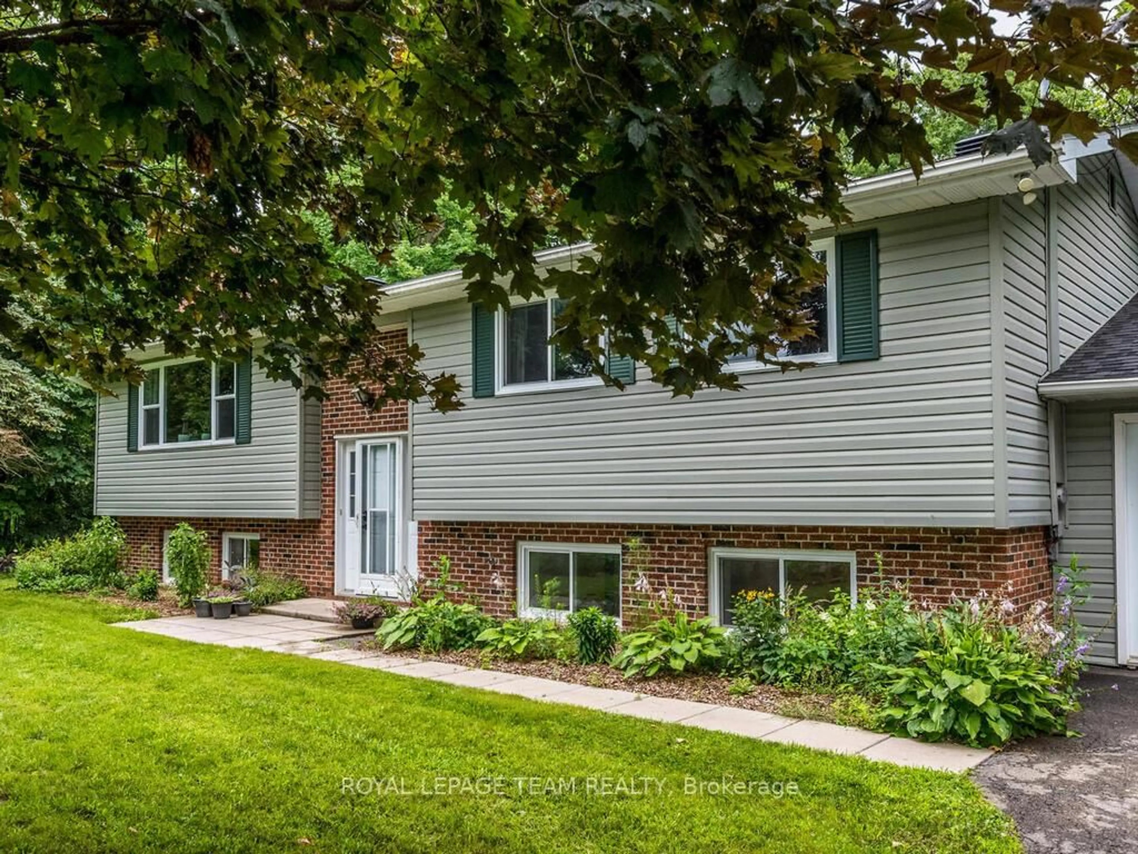Home with brick exterior material, street for 6677 ROGER STEVENS Dr, Smiths Falls Ontario K7A 4S6