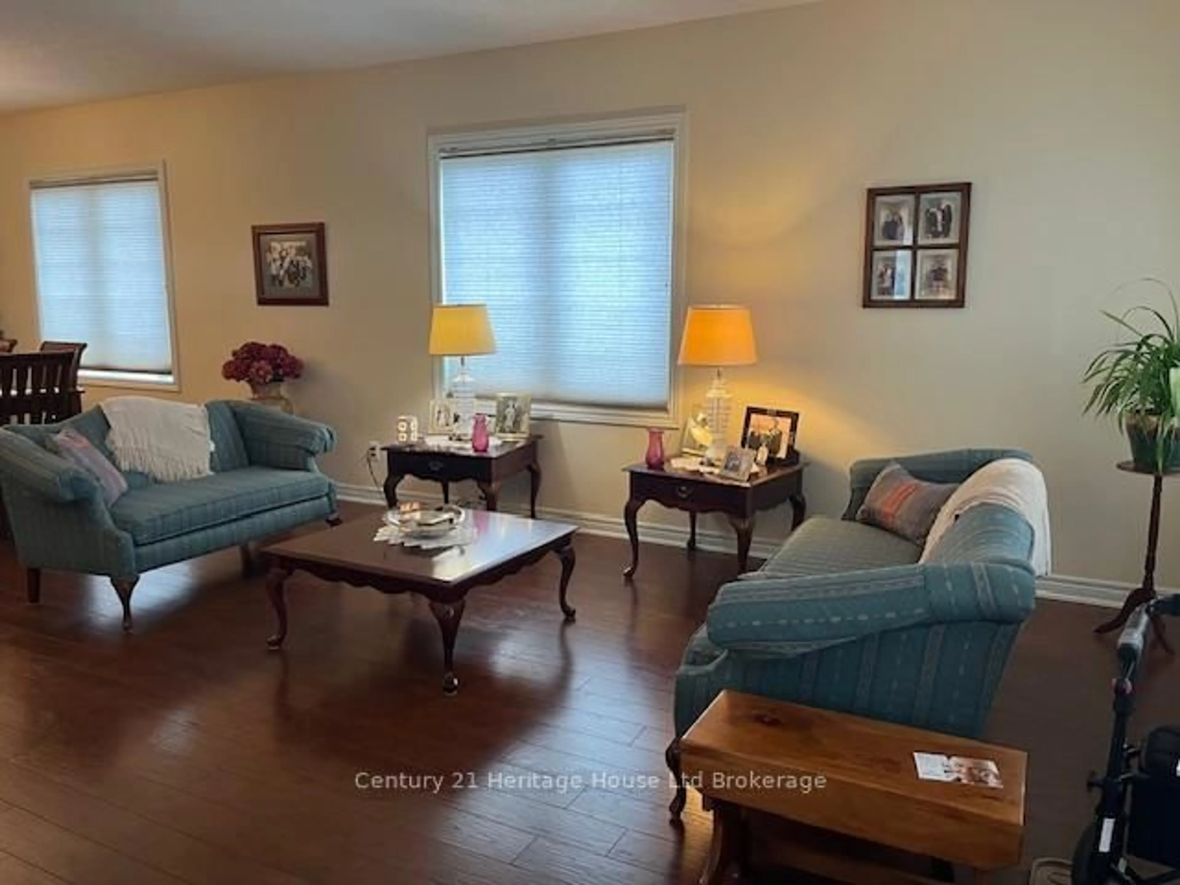 Living room with furniture, wood/laminate floor for 21 Balazs Crt #1, Tillsonburg Ontario N4G 5W6
