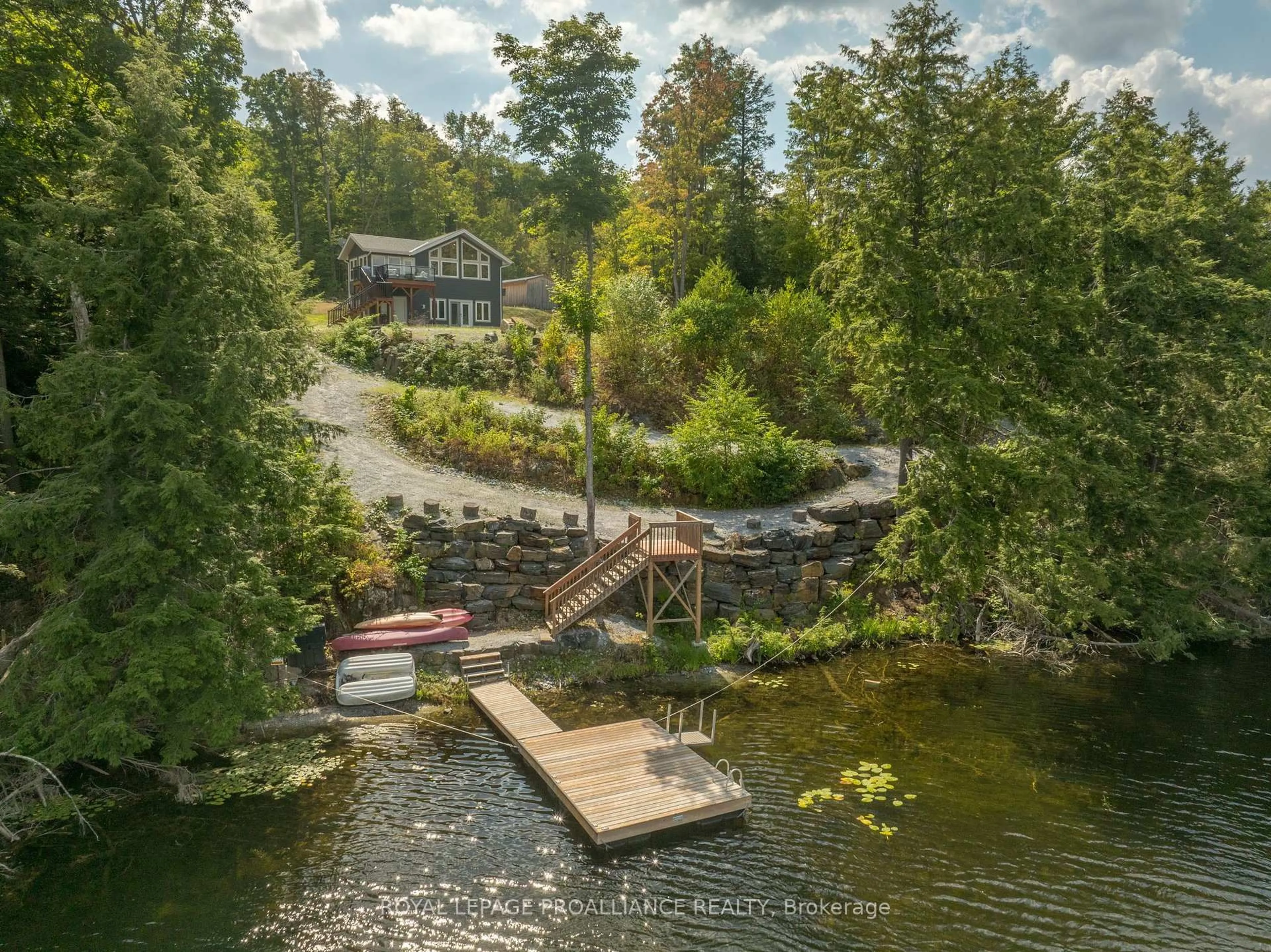 A pic from outside/outdoor area/front of a property/back of a property/a pic from drone, water/lake/river/ocean view for 1053C Granite Terrace Lane, Ompah Ontario K0H 2J0