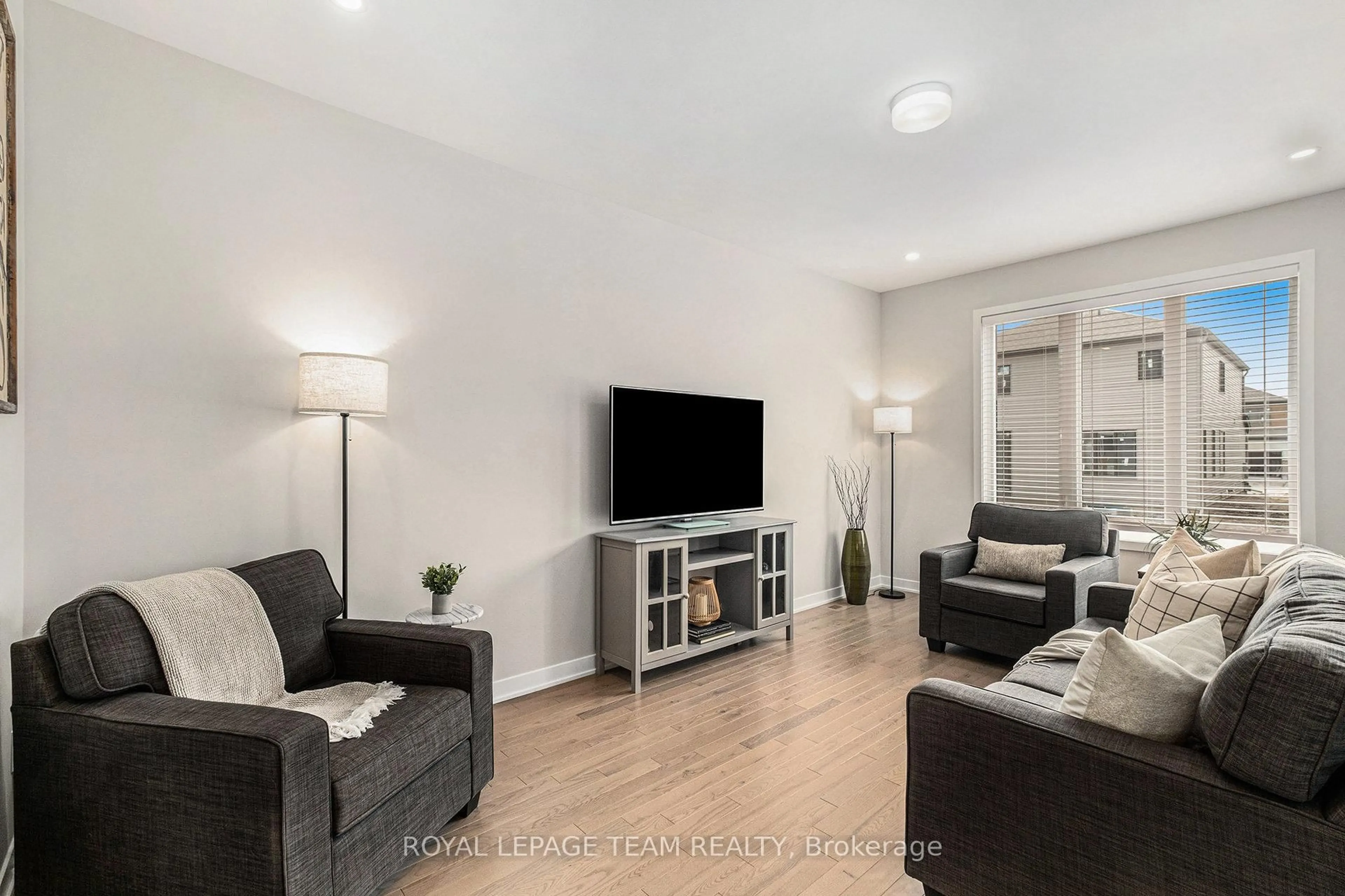 Living room with furniture, wood/laminate floor for 149 Robert Perry St, North Grenville Ontario K0G 1J0
