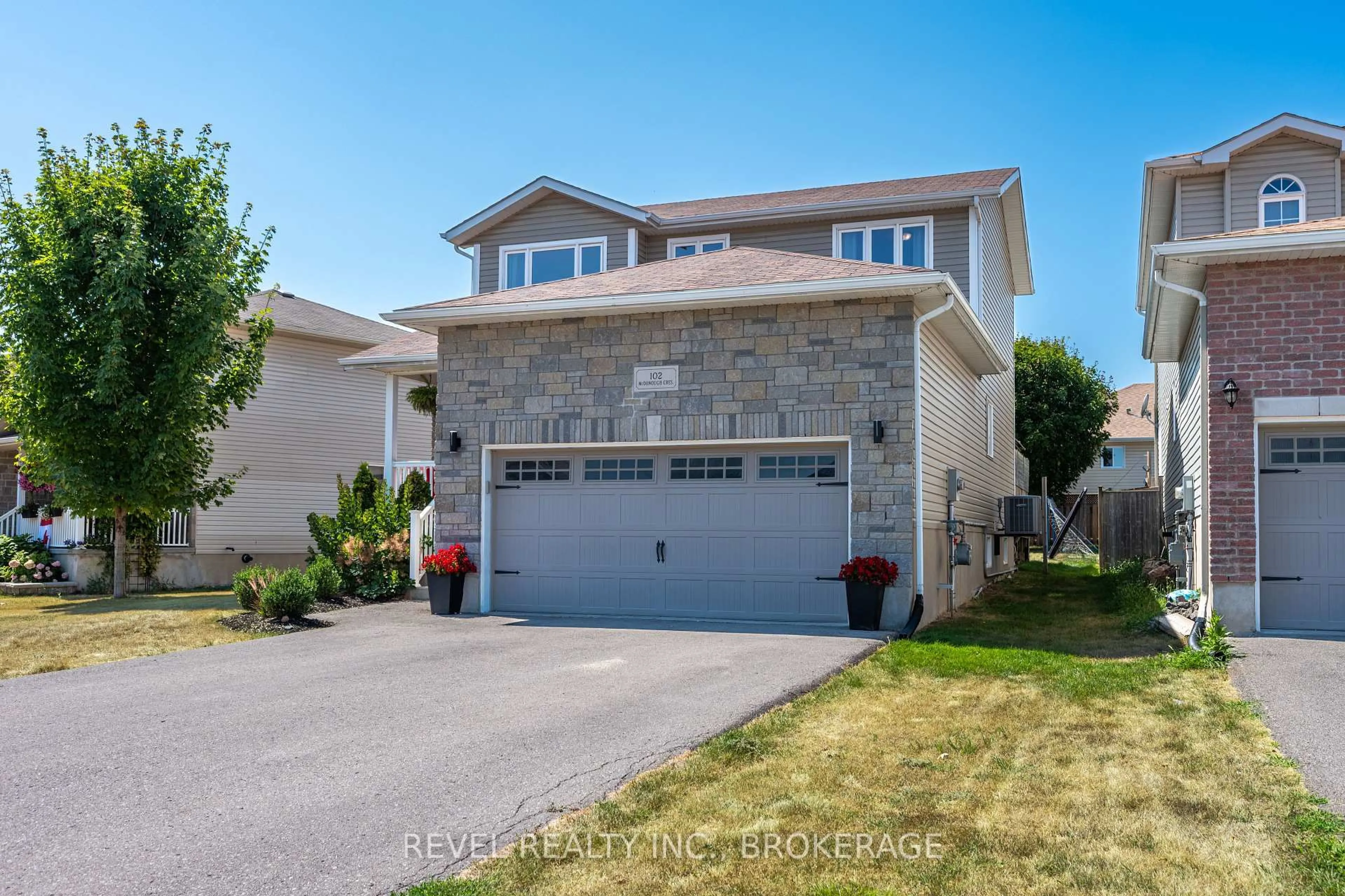 Home with vinyl exterior material, street for 102 Mcdonough Cres, Loyalist Ontario K7N 0A4