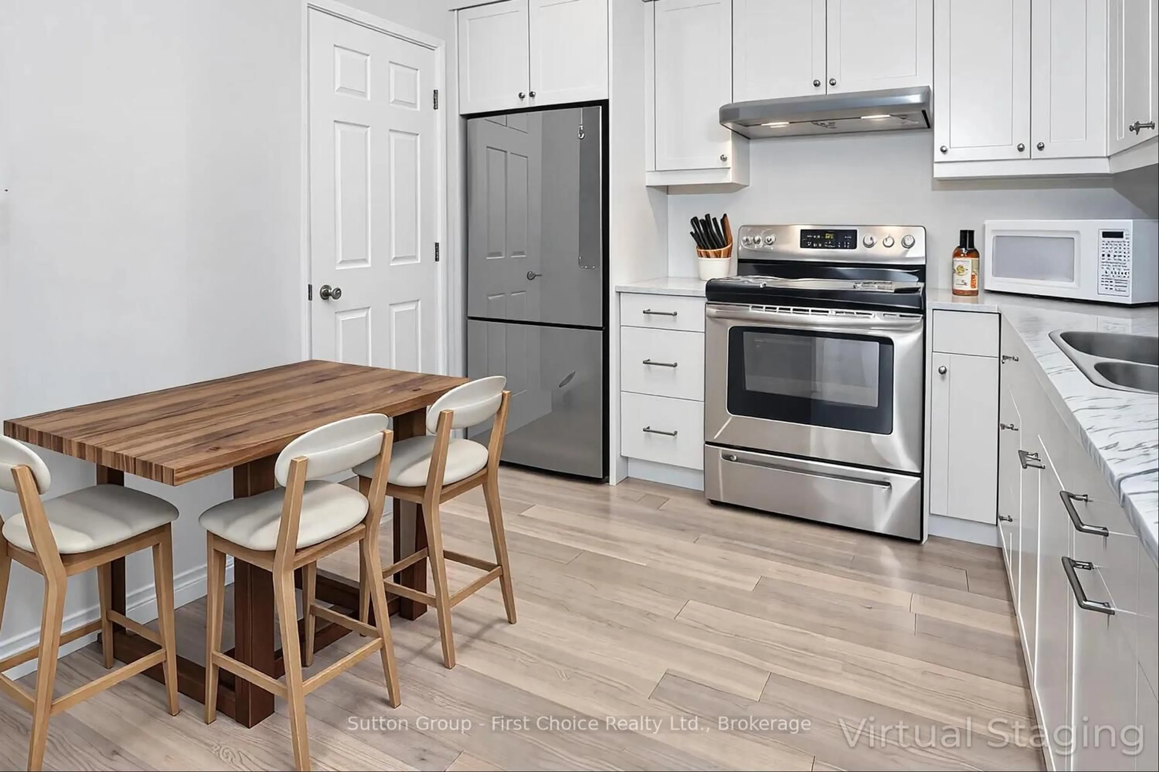Open concept kitchen, wood/laminate floor for 50 Campbell Crt #110, Stratford Ontario N5A 7T6