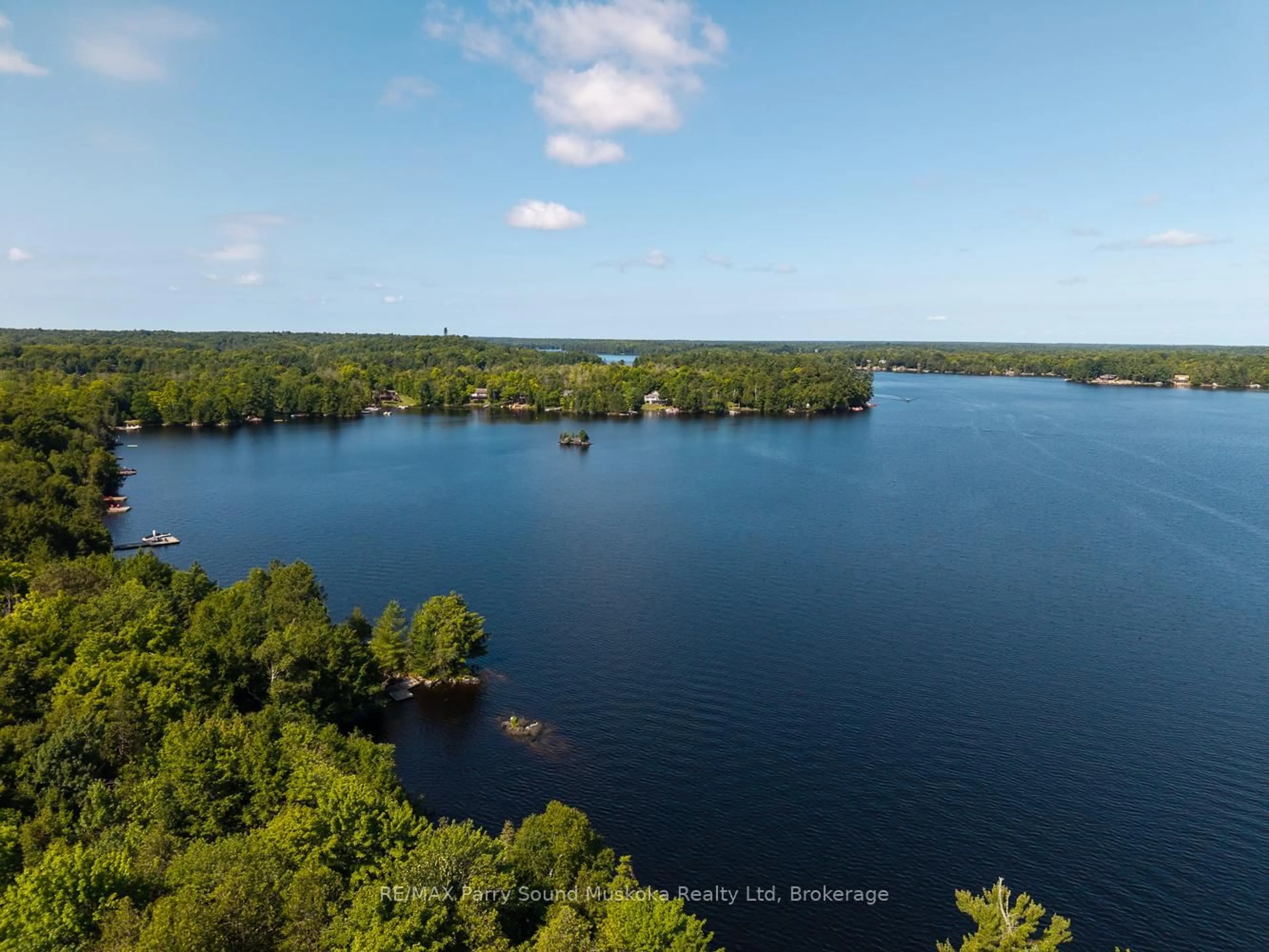 A pic from outside/outdoor area/front of a property/back of a property/a pic from drone, water/lake/river/ocean view for 28 Stormy Point Rd, McKellar Ontario P2A 0B5