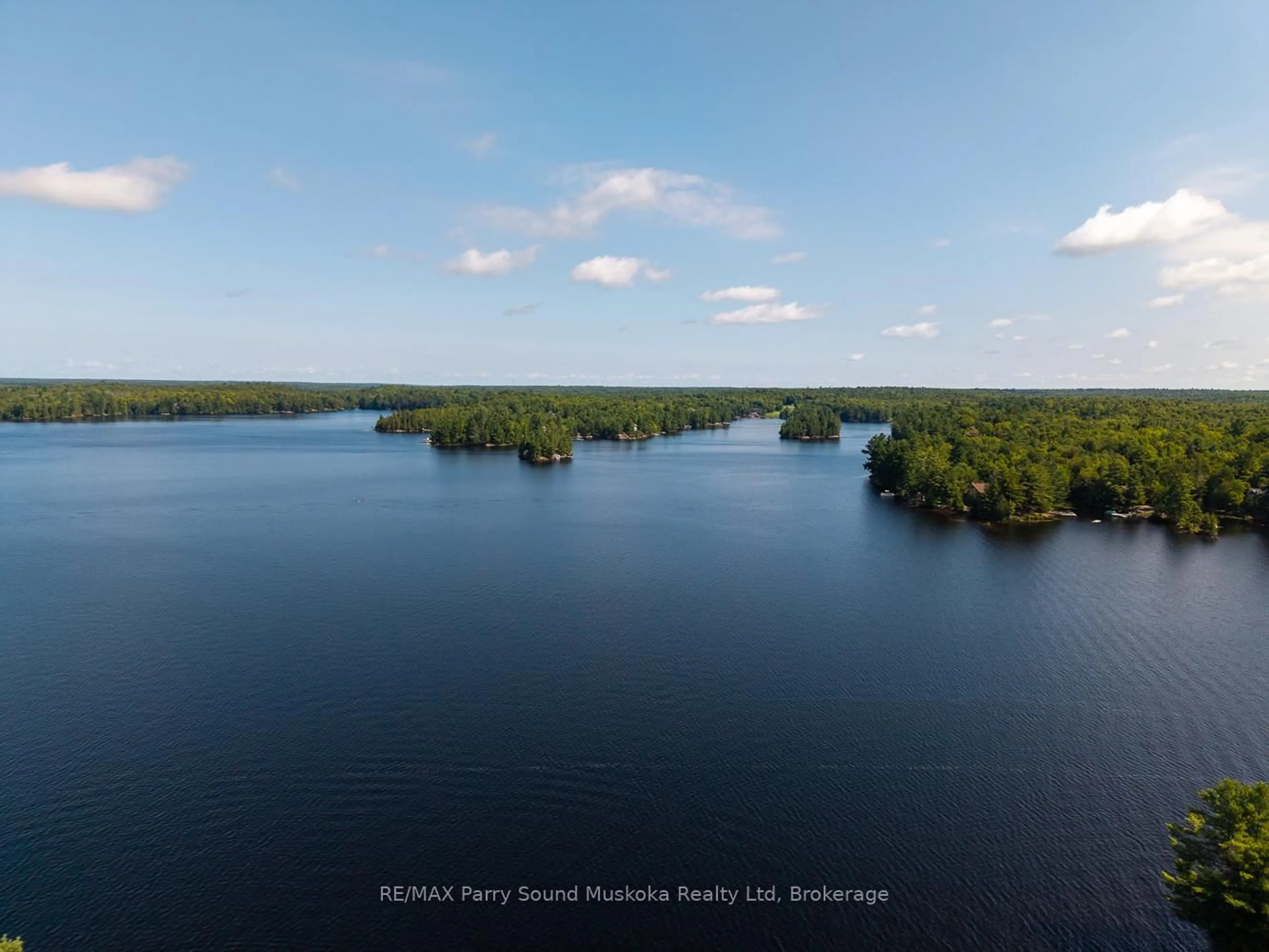 A pic from outside/outdoor area/front of a property/back of a property/a pic from drone, water/lake/river/ocean view for 28 Stormy Point Rd, McKellar Ontario P2A 0B5