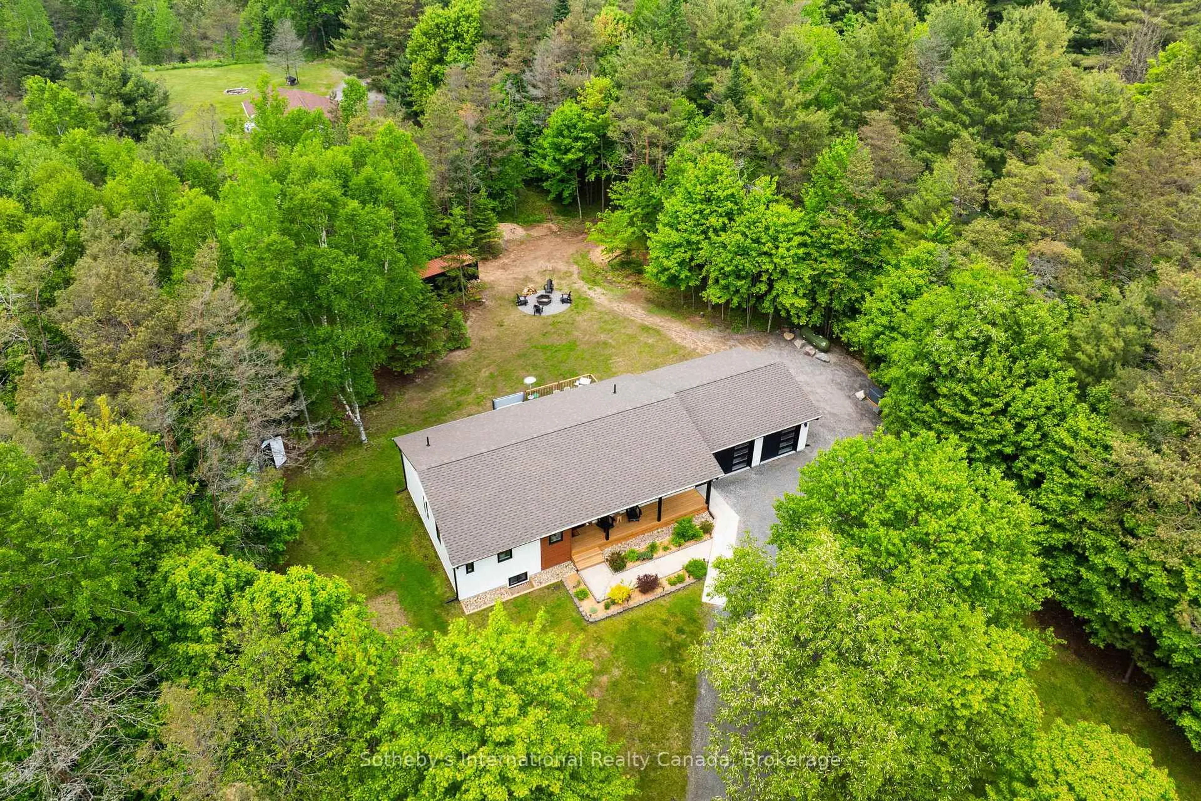 A pic from outside/outdoor area/front of a property/back of a property/a pic from drone, forest/trees view for 348 Fowlers Rd, Huntsville Ontario P1H 2N5