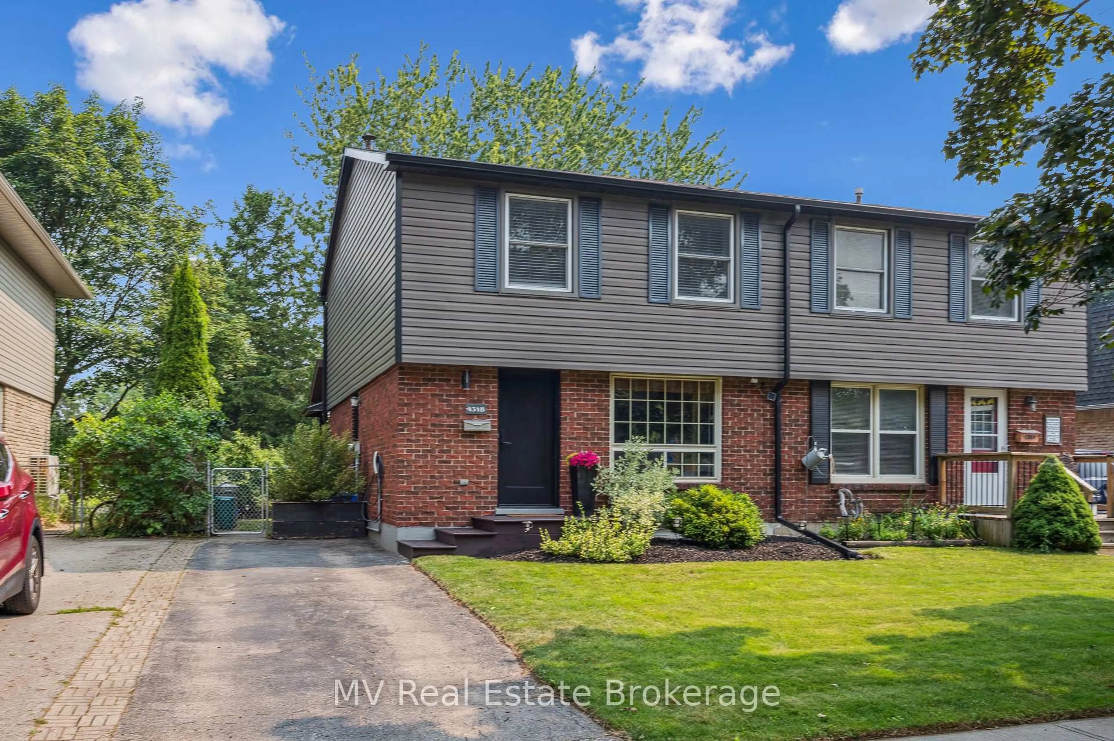 Home with brick exterior material, street for 434B Dunvegan Dr, Waterloo Ontario N2K 2C7