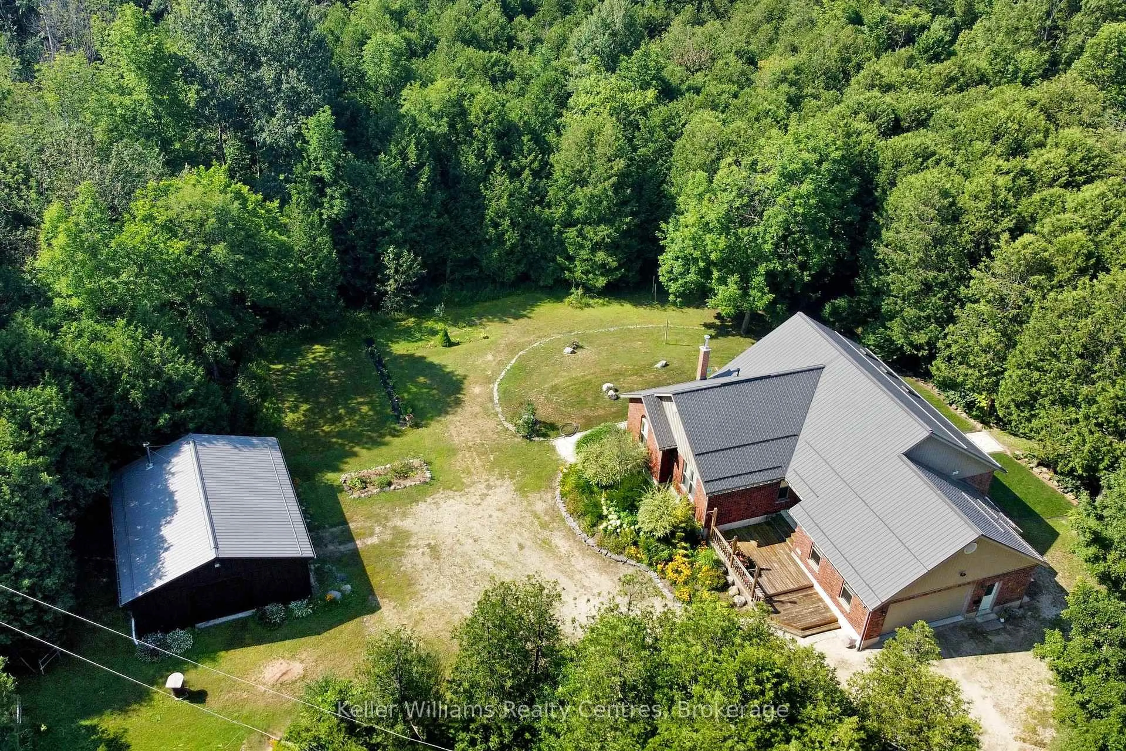 A pic from outside/outdoor area/front of a property/back of a property/a pic from drone, forest/trees view for 034660 Sideroad 5 NDR, West Grey Ontario N0G 1S0
