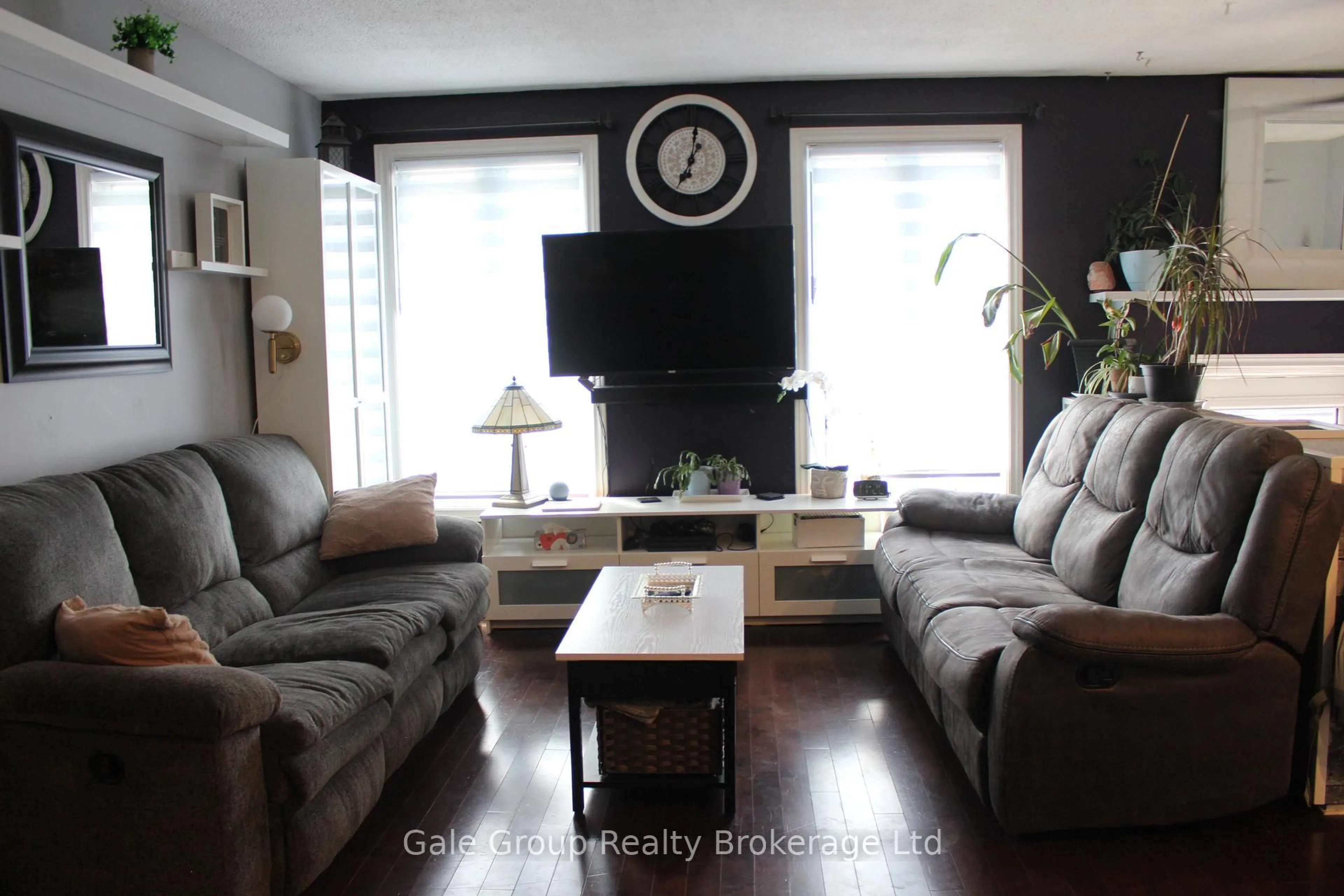 Living room with furniture, wood/laminate floor for 1133 Pearson Dr, Woodstock Ontario N4S 8J4