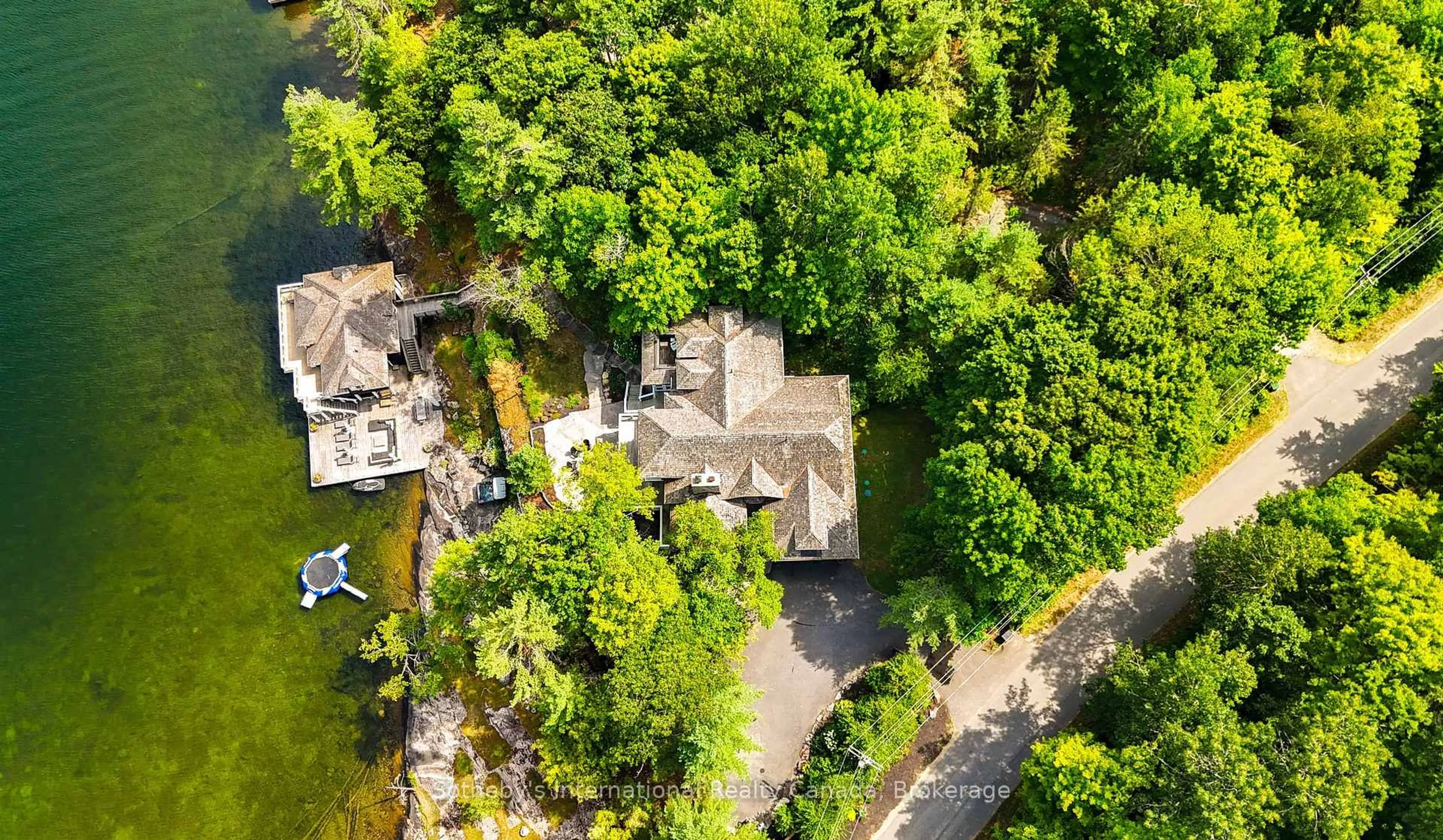 A pic from outside/outdoor area/front of a property/back of a property/a pic from drone, street for 1037 Elgin House Rd, Muskoka Lakes Ontario P0B 1J0