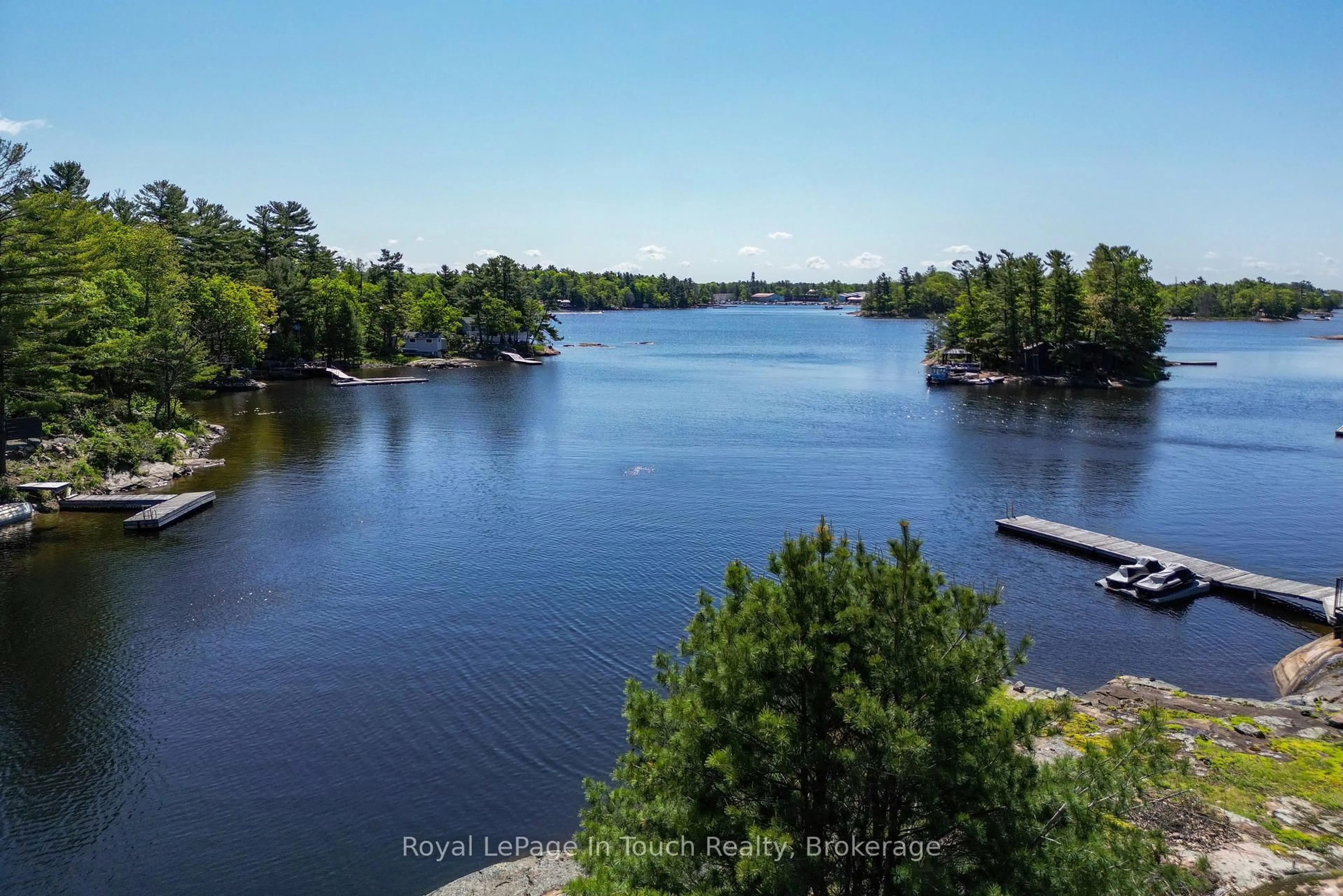 A pic from outside/outdoor area/front of a property/back of a property/a pic from drone, water/lake/river/ocean view for 1878 Island 1040, Georgian Bay Ontario P0E 1E0