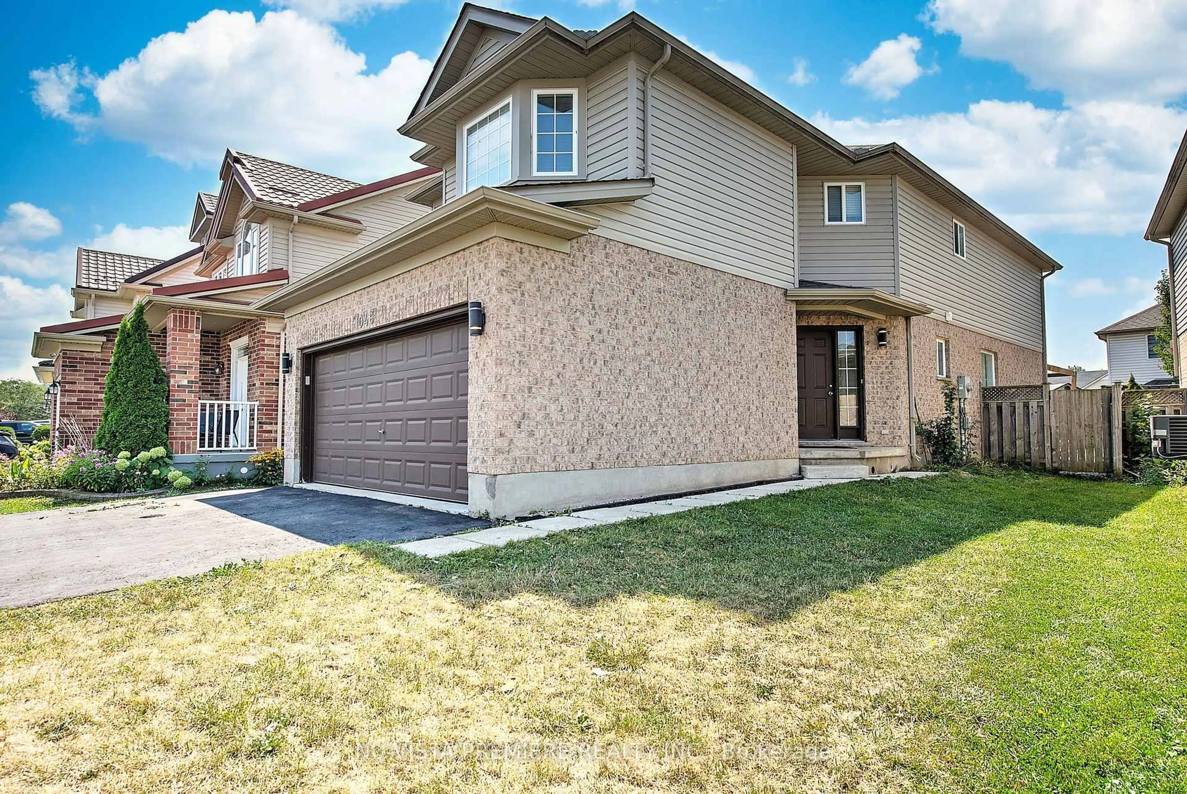 Home with brick exterior material, street for 1046 CROSSCREEK Cres, London East Ontario N5Y 6K9
