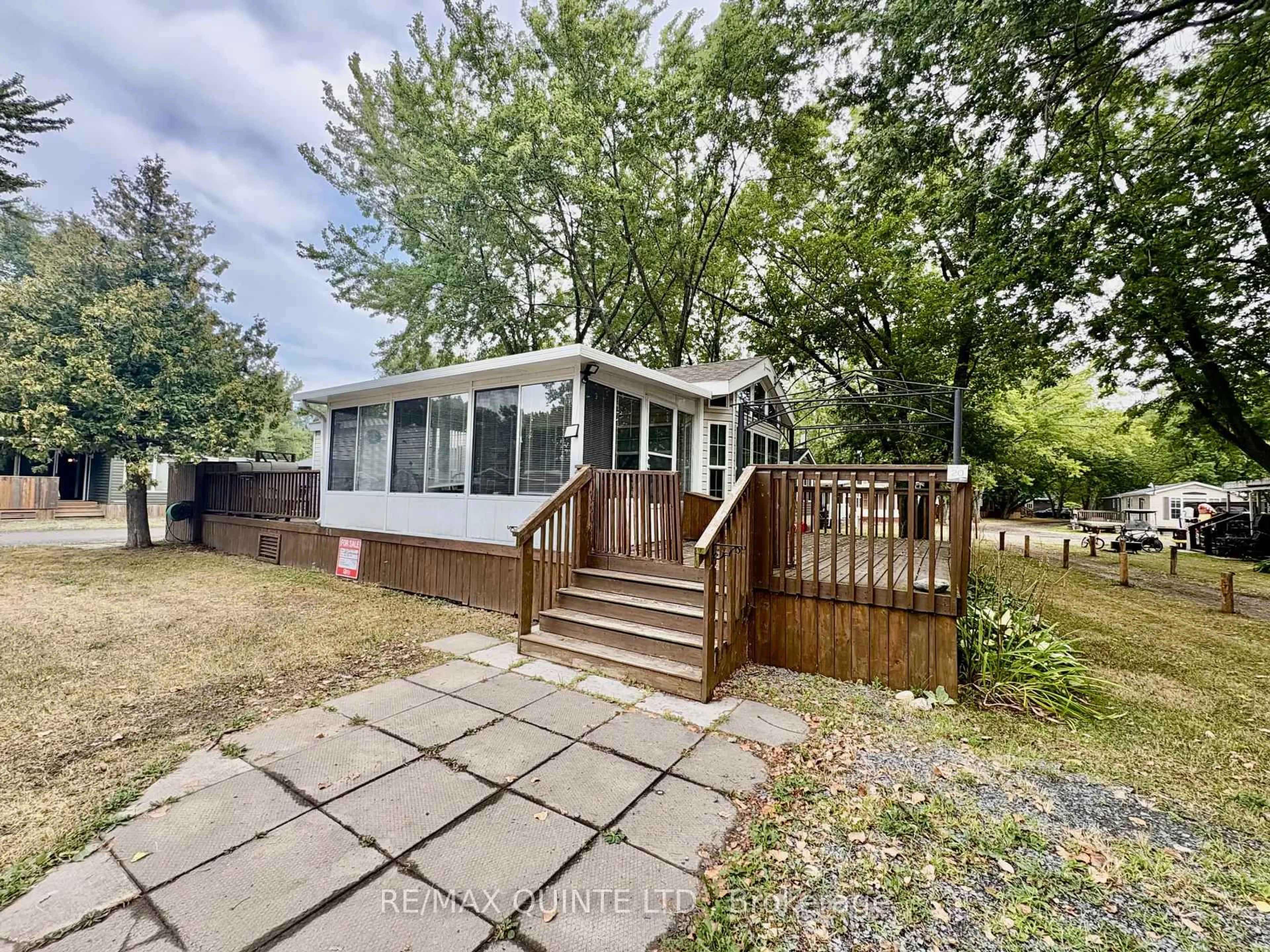 A pic from outside/outdoor area/front of a property/back of a property/a pic from drone, unknown for 486 County Rd 18 Rd #20 Cherry Beach Lane, Prince Edward County Ontario K0K 1P0