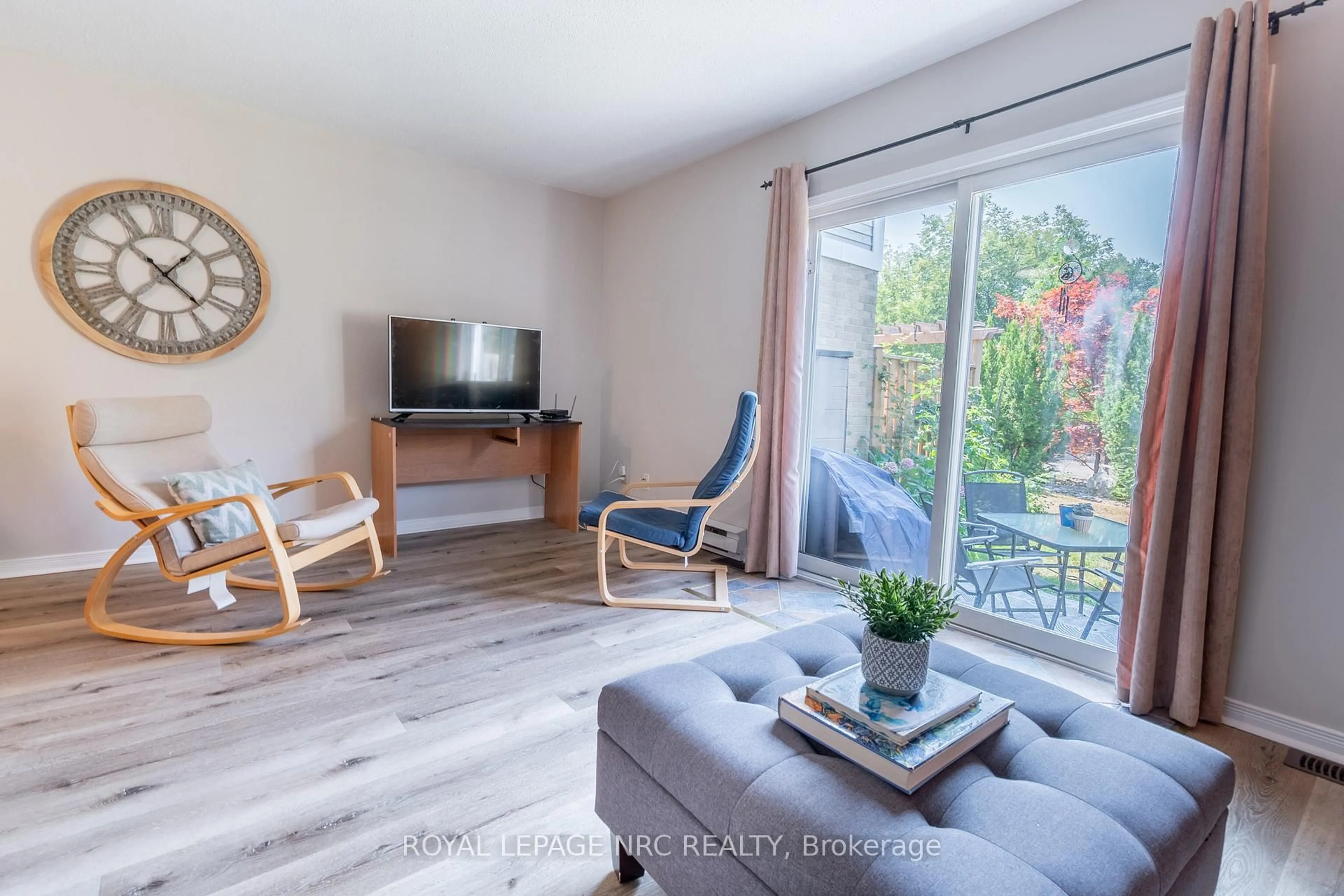 Living room with furniture, wood/laminate floor for 38 Elma St #4, St. Catharines Ontario L2N 6Z3