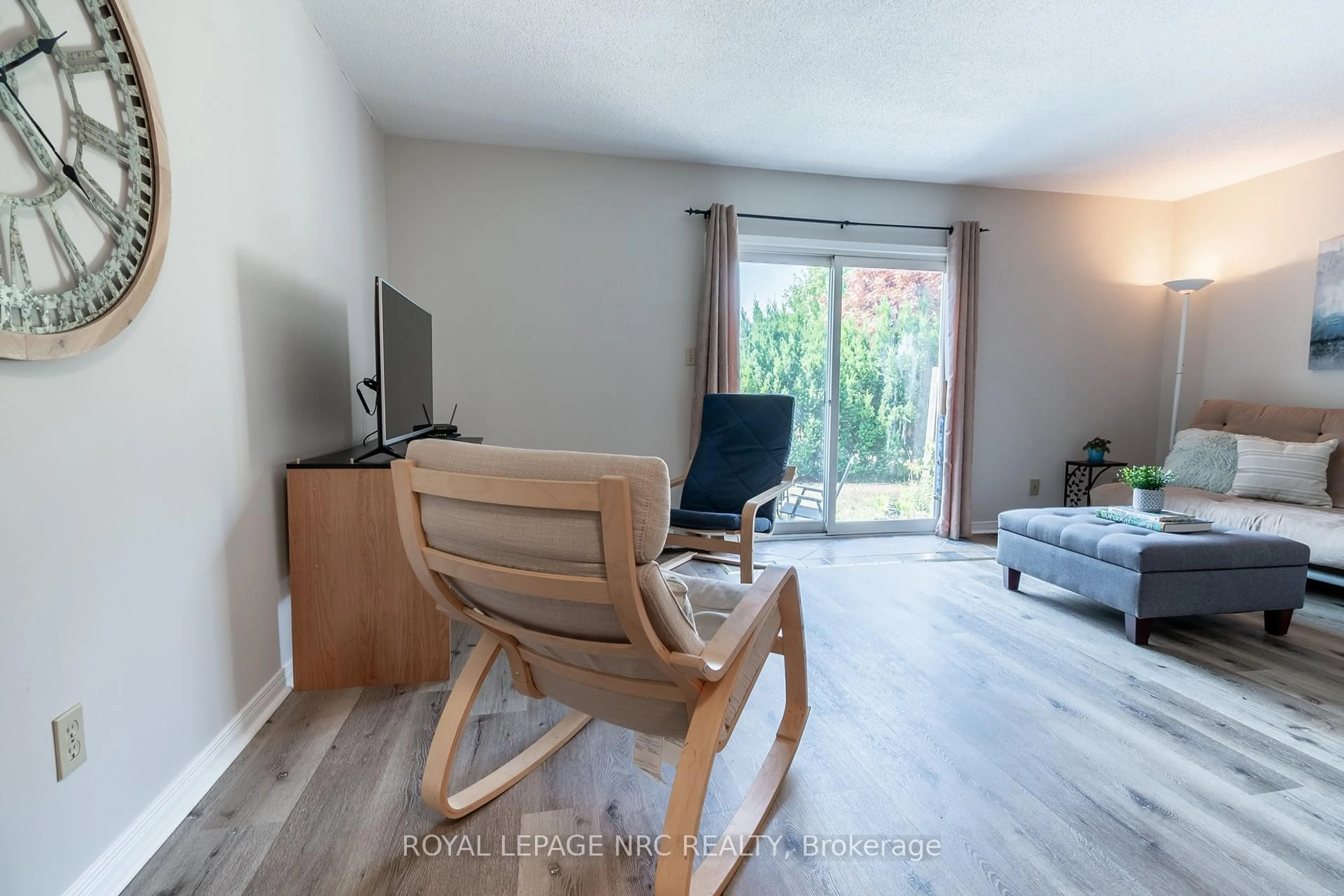 Living room with furniture, wood/laminate floor for 38 Elma St #4, St. Catharines Ontario L2N 6Z3