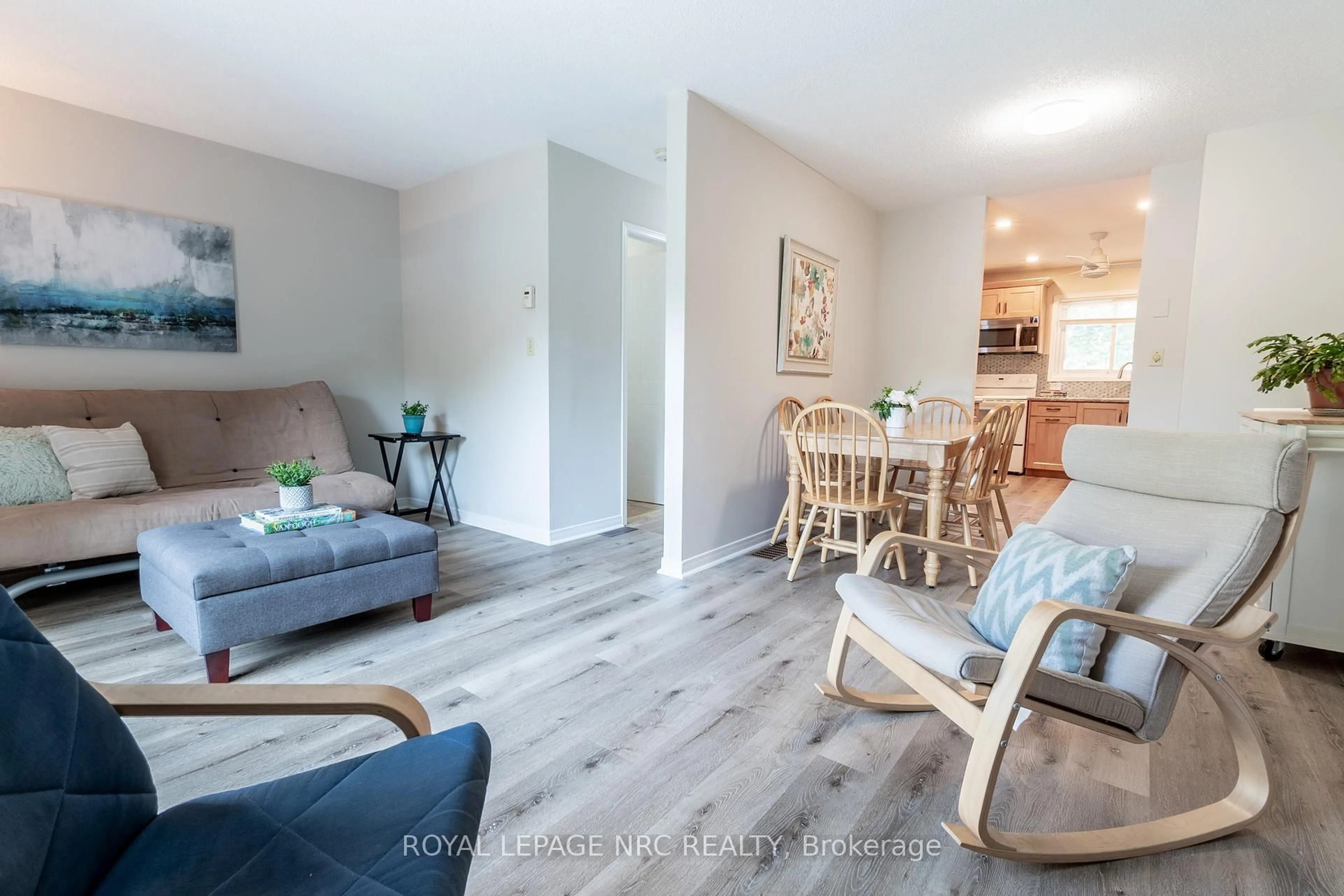 Living room with furniture, wood/laminate floor for 38 Elma St #4, St. Catharines Ontario L2N 6Z3