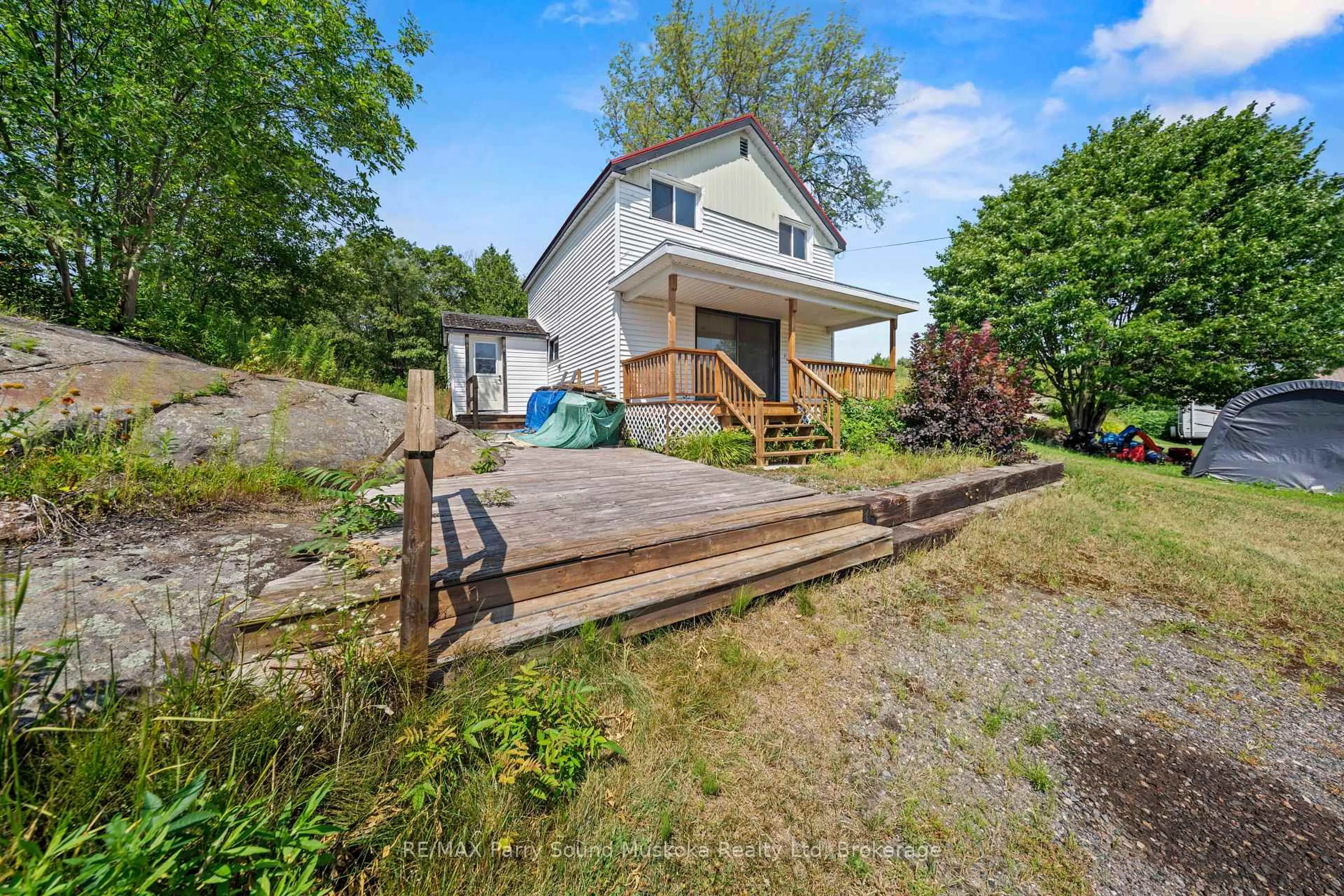 A pic from outside/outdoor area/front of a property/back of a property/a pic from drone, water/lake/river/ocean view for 1027 Riverside Dr, Parry Sound Remote Area Ontario P0G 1A0