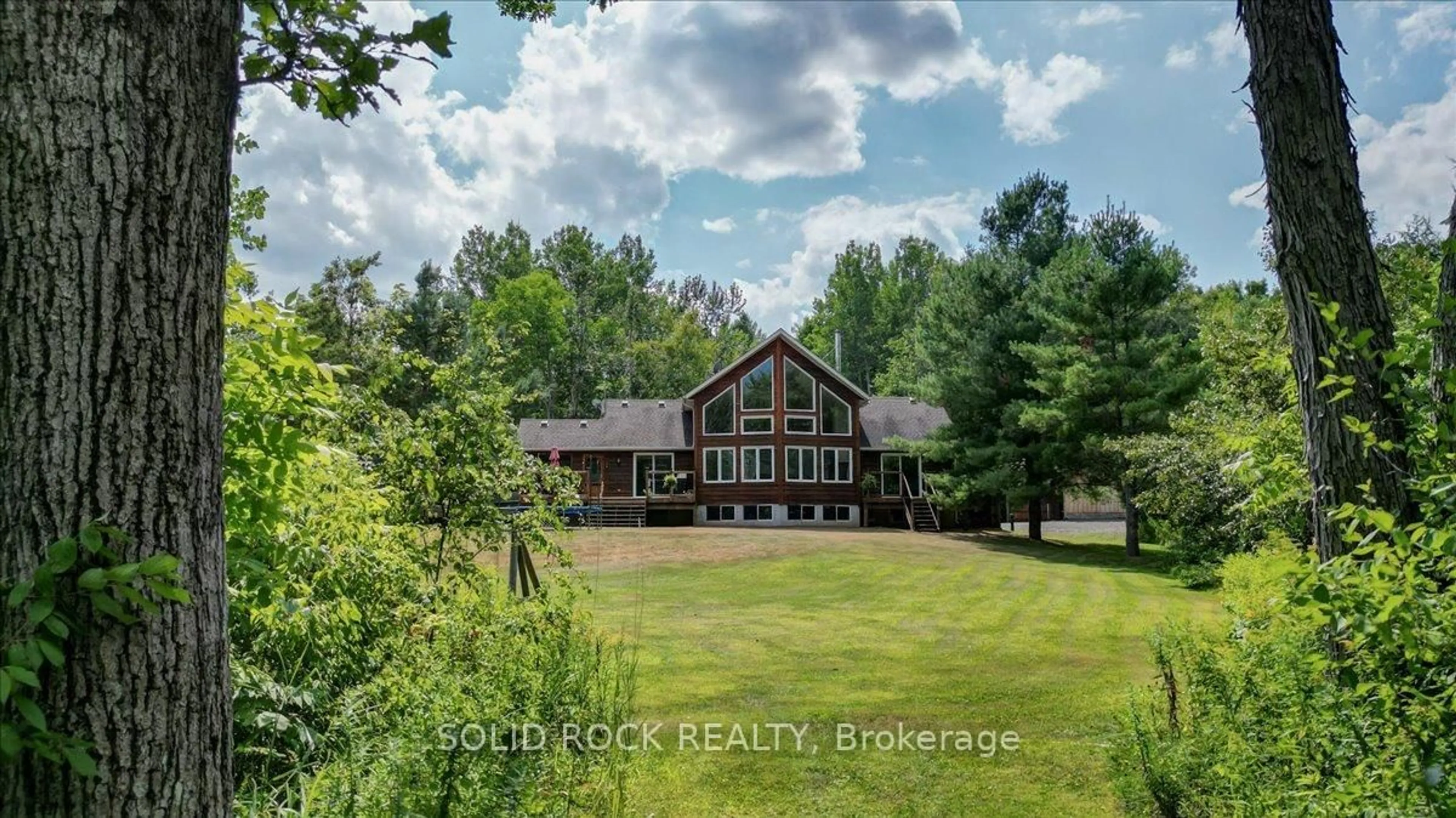A pic from outside/outdoor area/front of a property/back of a property/a pic from drone, water/lake/river/ocean view for 564 Bosley Rd, Madoc Ontario K0K 2K0