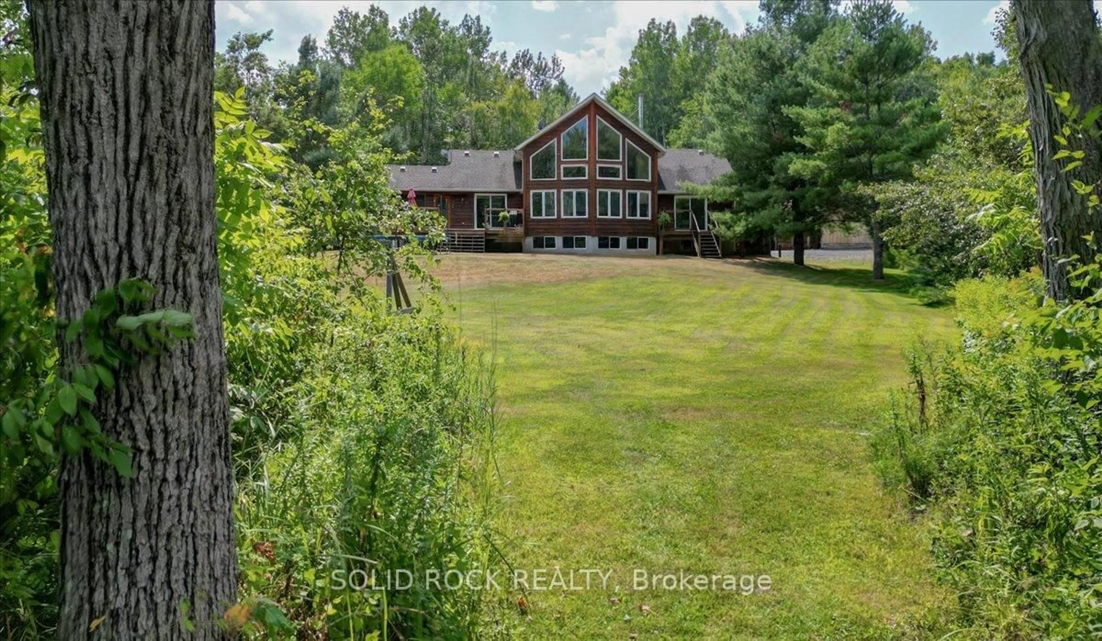 A pic from outside/outdoor area/front of a property/back of a property/a pic from drone, water/lake/river/ocean view for 564 Bosley Rd, Madoc Ontario K0K 2K0