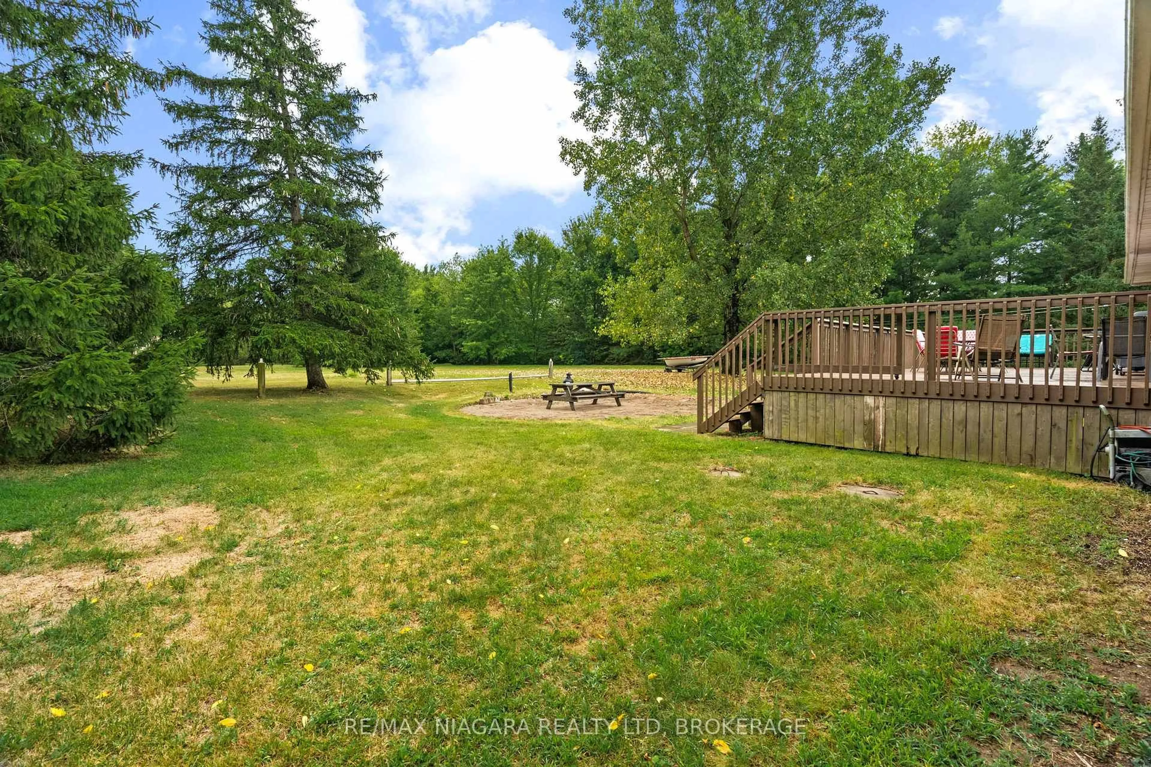 A pic from outside/outdoor area/front of a property/back of a property/a pic from drone, forest/trees view for 594 Doans Ridge Rd, Welland Ontario L3B 5N7