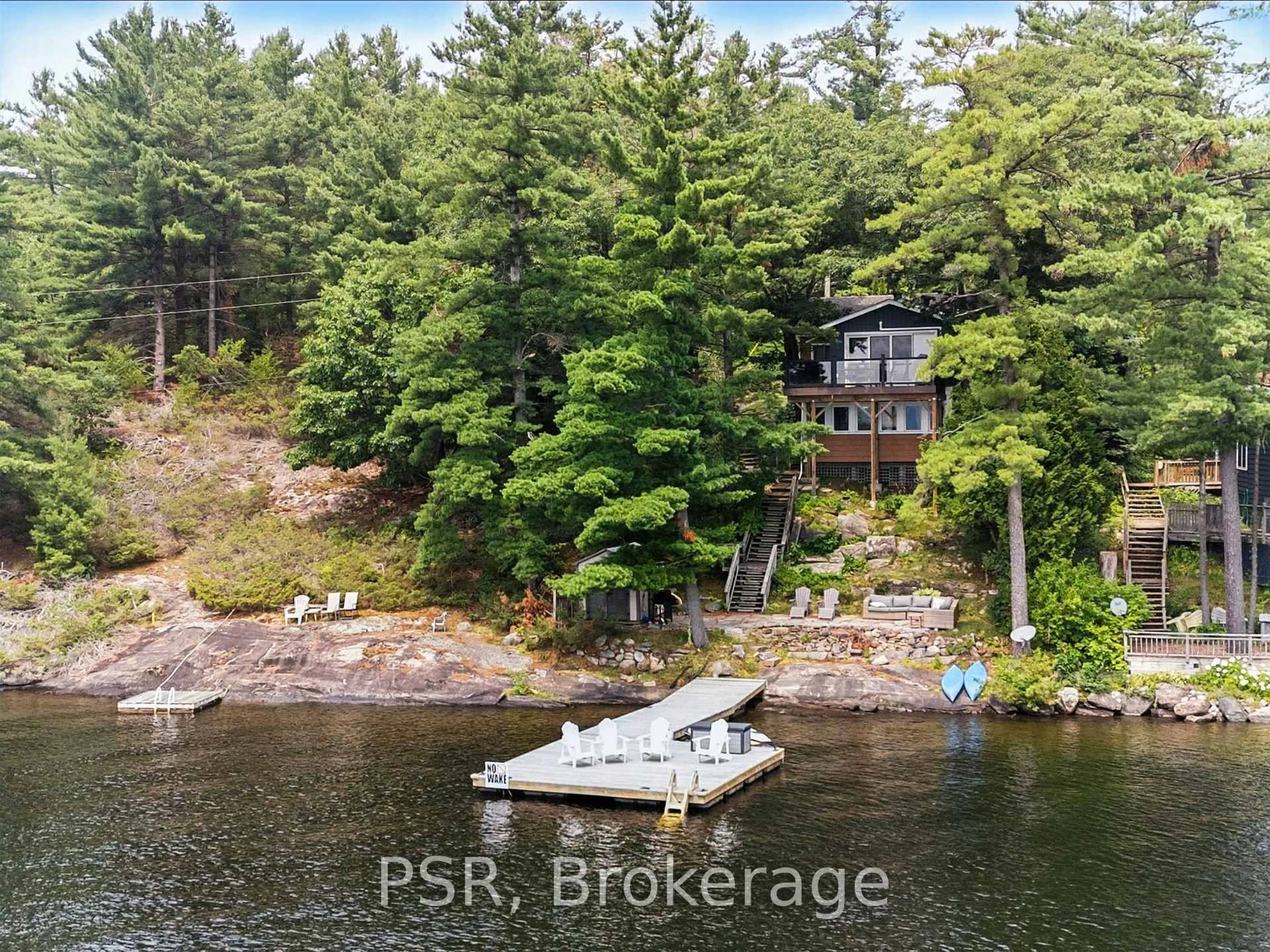 A pic from outside/outdoor area/front of a property/back of a property/a pic from drone, water/lake/river/ocean view for 1166 Parkers Point Rd, Gravenhurst Ontario P1P 1R2